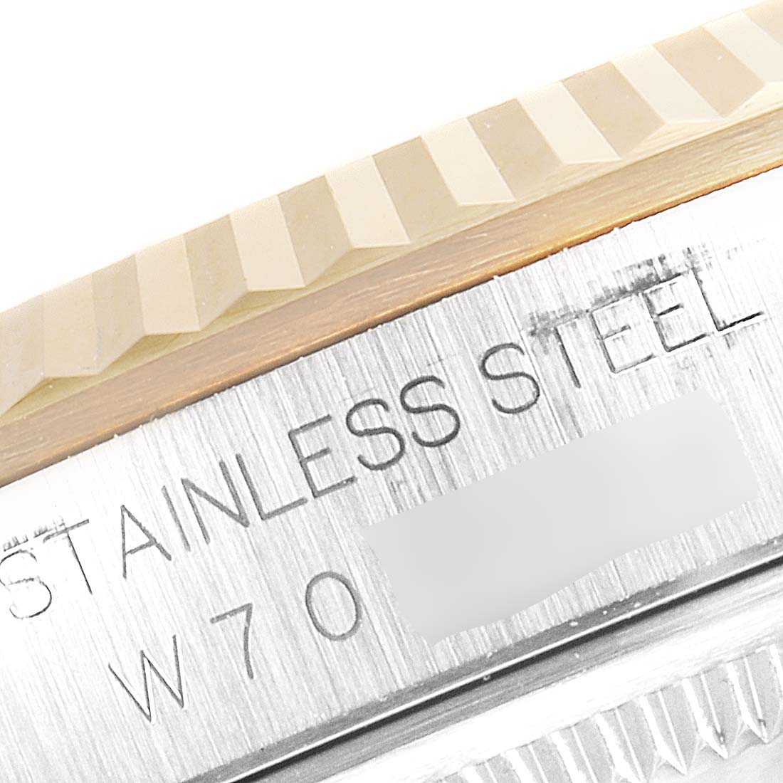 The image shows a close-up of the stainless steel casing and fluted bezel of a Rolex Datejust 16233 Men's Steel and Gold (two tone) Champagne Dial 16233 Men's Steel and Gold (two tone) Champagne Dial watch.