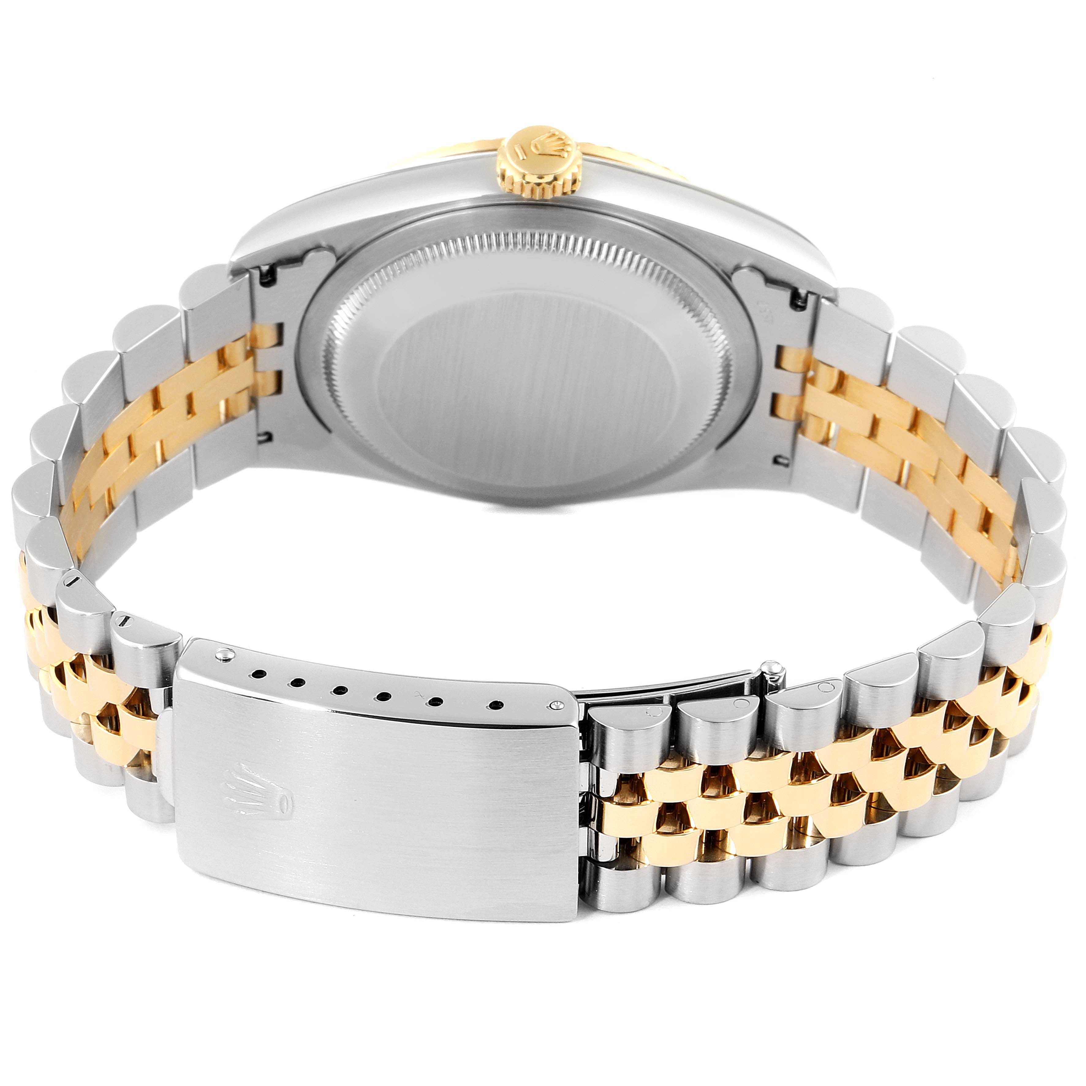 The image shows the back view of the Rolex Datejust 16233 Men's Steel and Gold (two tone) Champagne Dial 16233 Men's Steel and Gold (two tone) Champagne Dial watch, focusing on the case back and the two-tone bracelet with the clasp.