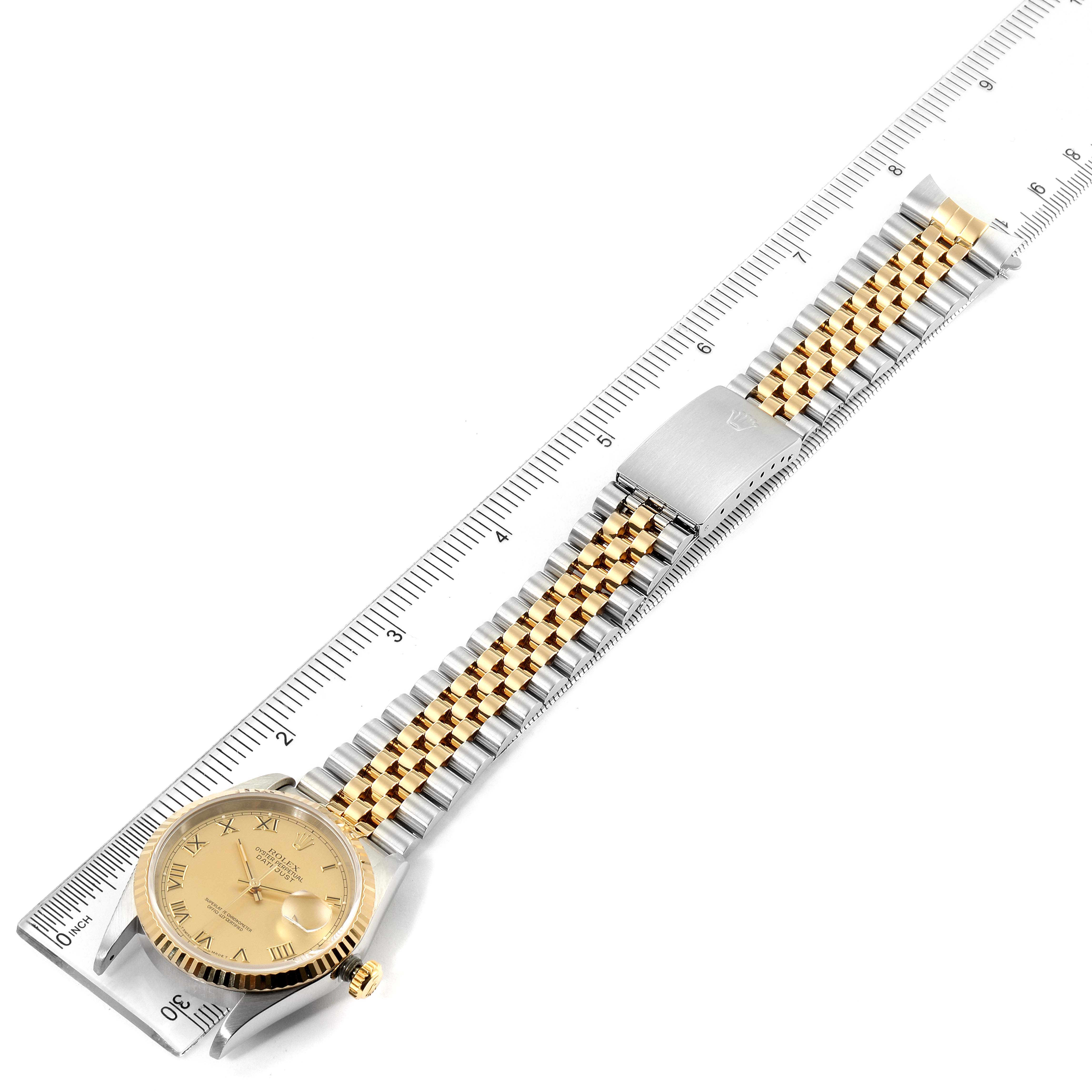 The image shows a Rolex Datejust 16233 Men's Steel and Gold (two tone) Champagne Dial 16233 Men's Steel and Gold (two tone) Champagne Dial watch laid flat next to a ruler, displaying its gold and silver bracelet and dial at a top-down angle.
