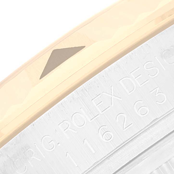 This image shows a close-up of the bezel and part of the casing with engraved text of a Rolex Turn-o-Graph 116263 Men
s Steel and Gold (two tone) White Dial 116263 Men
s Steel and Gold (two tone) White Dial watch.