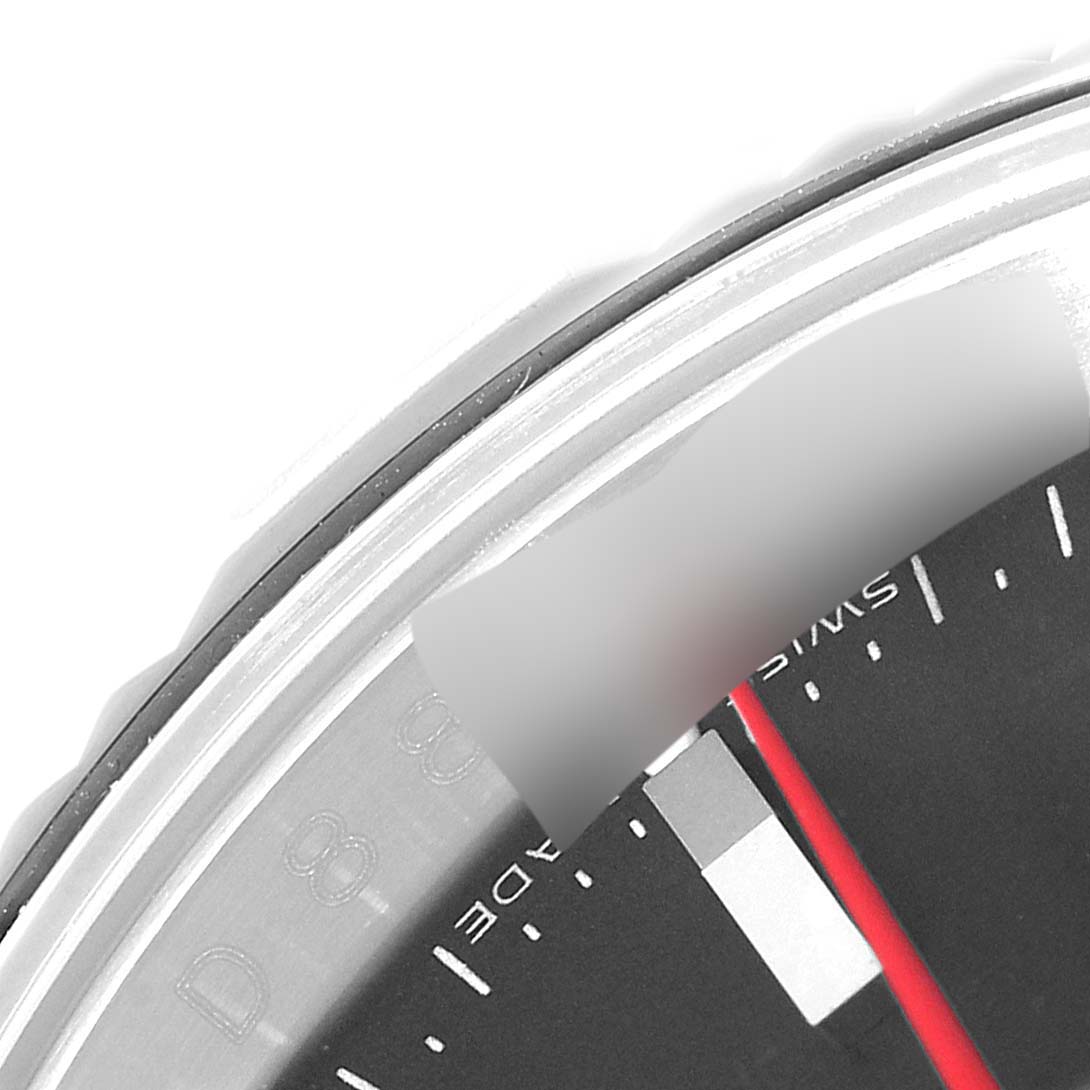The image shows a close-up of the bezel and part of the dial of a Rolex Turn-o-Graph 116264 Men's Stainless Steel Black Dial 116264 Men's Stainless Steel Black Dial watch, highlighting the markers and a portion of the red second hand.