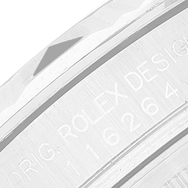 The image shows a close-up of the side engraving on the bezel of a Rolex Turn-o-Graph 116264 Men's Stainless Steel Black Dial 116264 Men's Stainless Steel Black Dial watch.