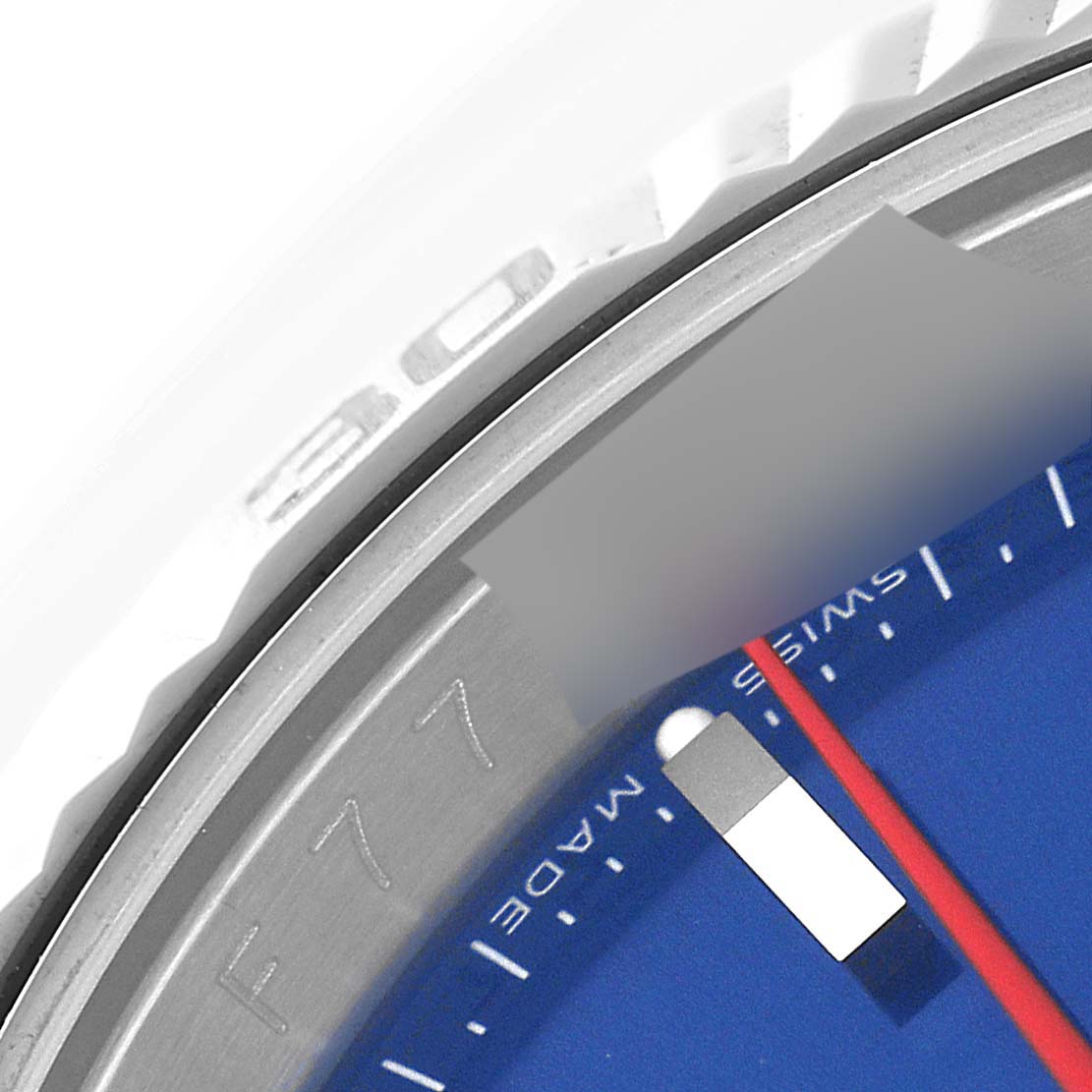 The image shows a close-up of the bezel, dial, and part of the minute hand of the Rolex Turn-o-Graph 116264 Men
s Stainless Steel Blue Dial 116264 Men
s Stainless Steel Blue Dial watch.