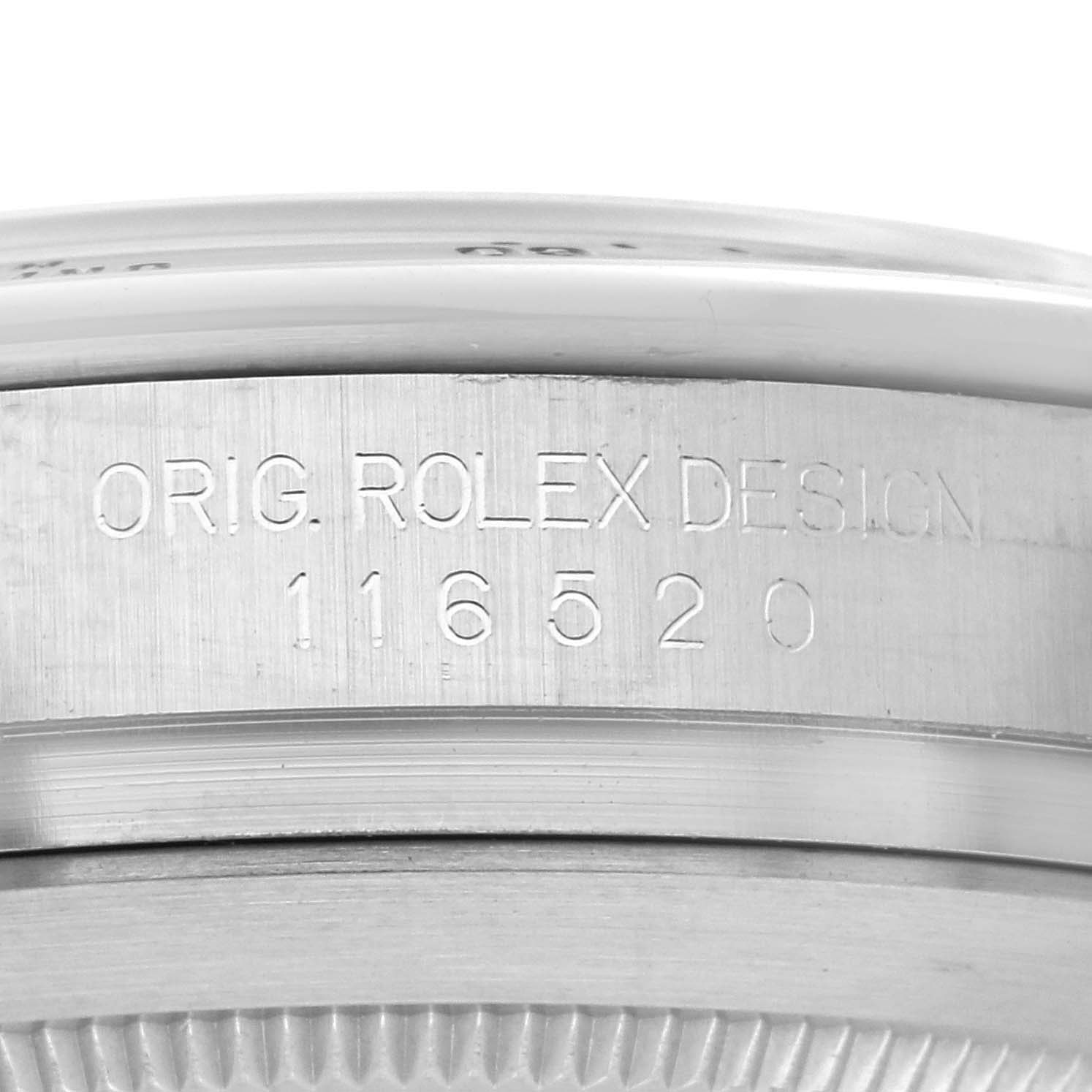 The image shows a close-up of the side of a Rolex Daytona 116520 Men's Stainless Steel White Dial 116520 Men's Stainless Steel White Dial, focusing on the engraved model number.