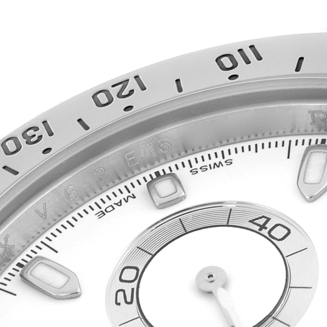 This image shows a close-up of the bezel and part of the dial of a Rolex Daytona 116520 Men's Stainless Steel White Dial 116520 Men's Stainless Steel White Dial, highlighting numerals and a subdial.