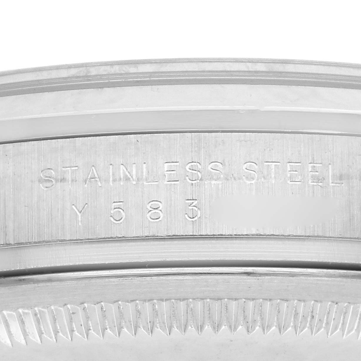 The image shows a close-up of the stainless steel case back and serial number on a Rolex Explorer 114270 Men
s Stainless Steel Black Dial 114270 Men
s Stainless Steel Black Dial watch.