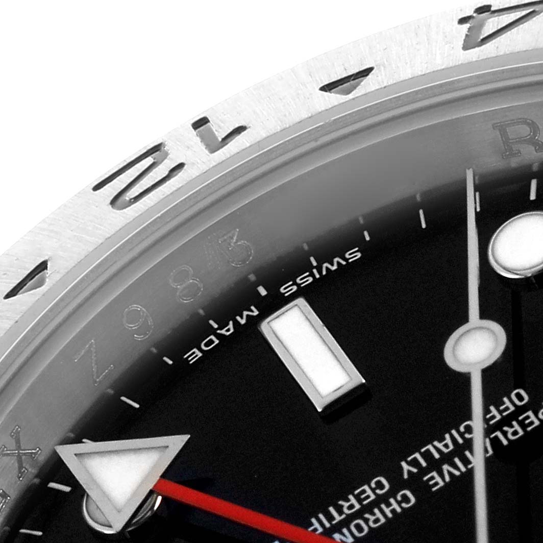 The image shows a close-up of the Rolex Explorer 16570T Men
s Stainless Steel Black Dial 16570T Men
s Stainless Steel Black Dial
s bezel, partial dial, and hands from an angled perspective.
