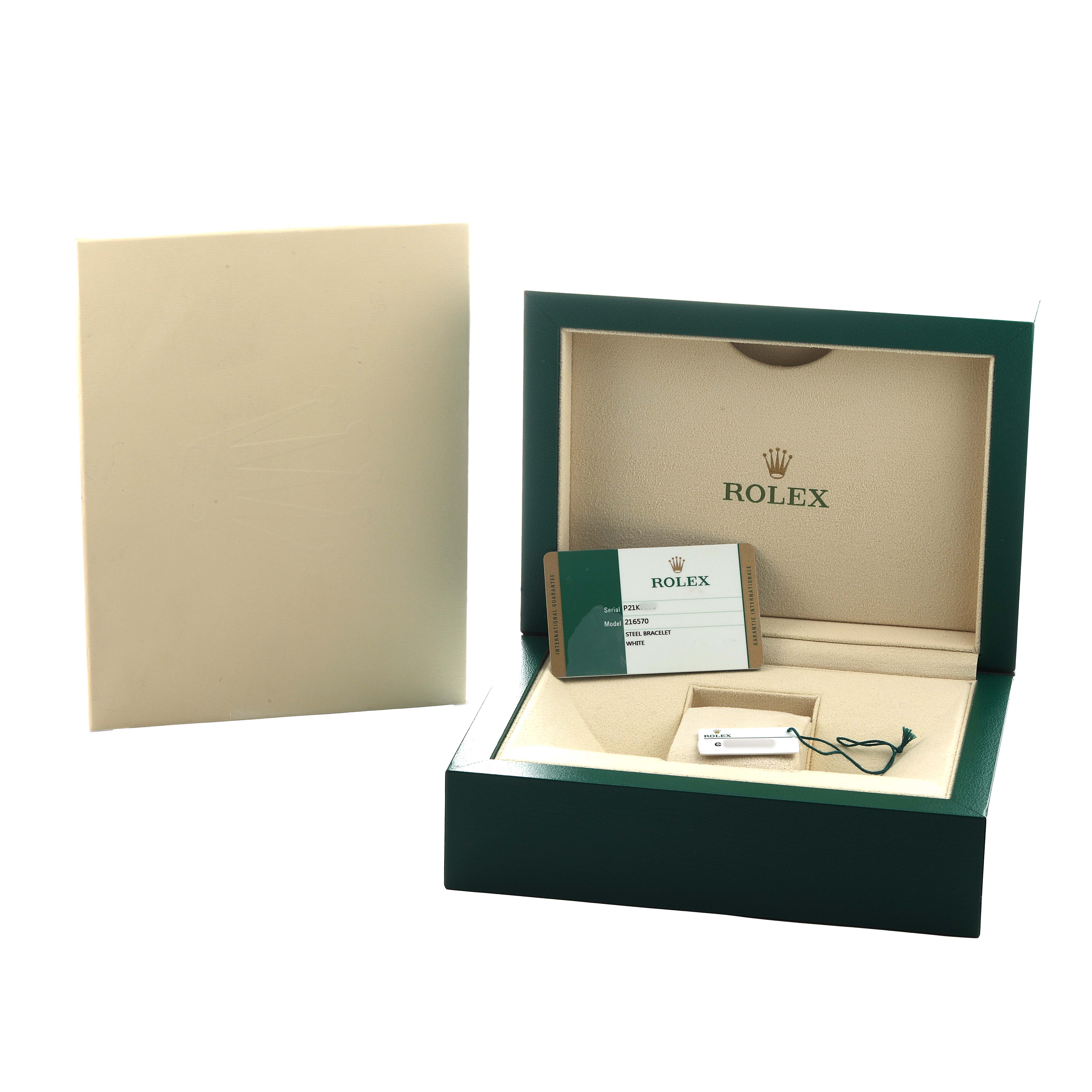 The image shows a Rolex Explorer 216570 Men's Stainless Steel White Dial box and warranty card at a slight angle, highlighting the packaging and accessories.