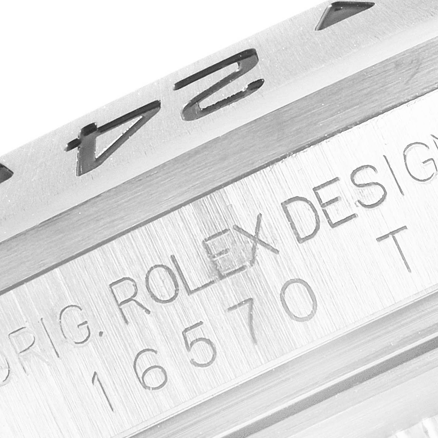 The image shows a close-up of the engraved bezel and case side of a Rolex Explorer 16570 Men
s Stainless Steel White Dial 16570 Men
s Stainless Steel White Dial model watch.
