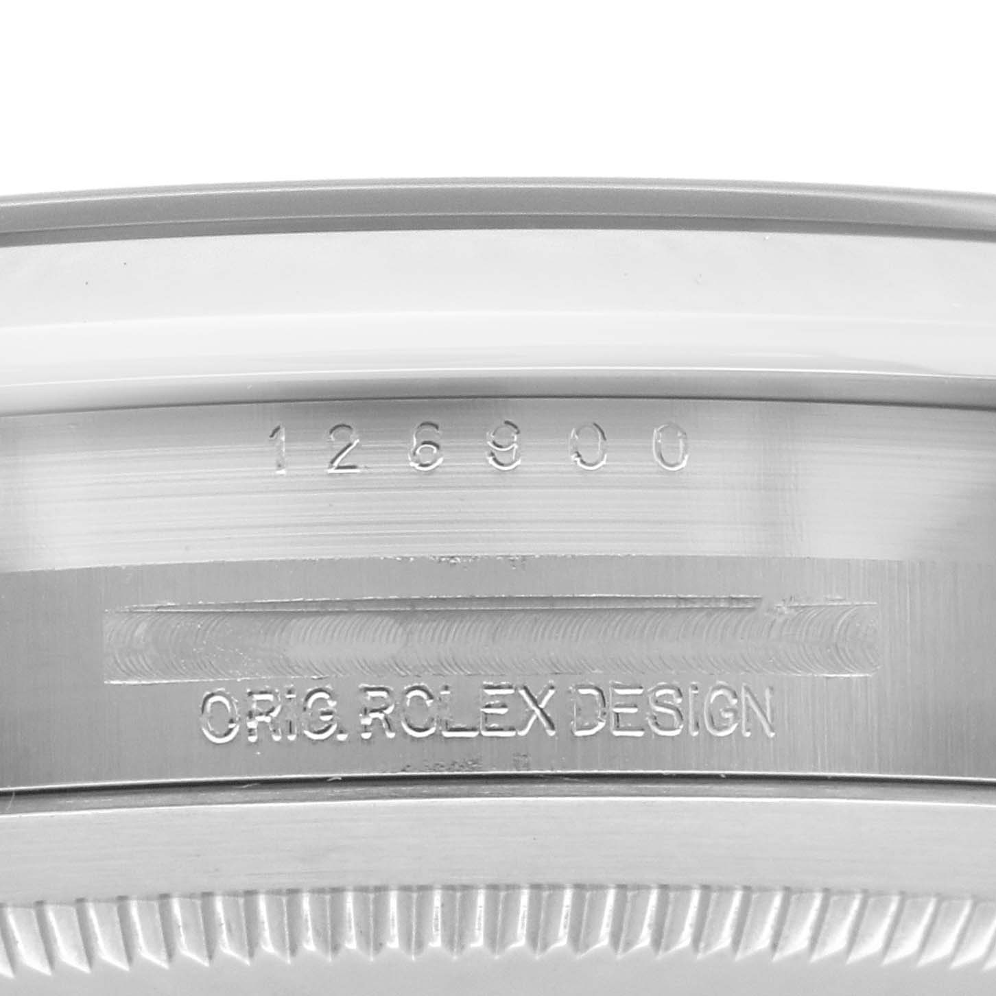 The image shows a close-up of the case side of the Rolex Air-King 126900 Men's Stainless Steel Black Dial 126900 Men's Stainless Steel Black Dial, highlighting the engraved serial and model numbers.