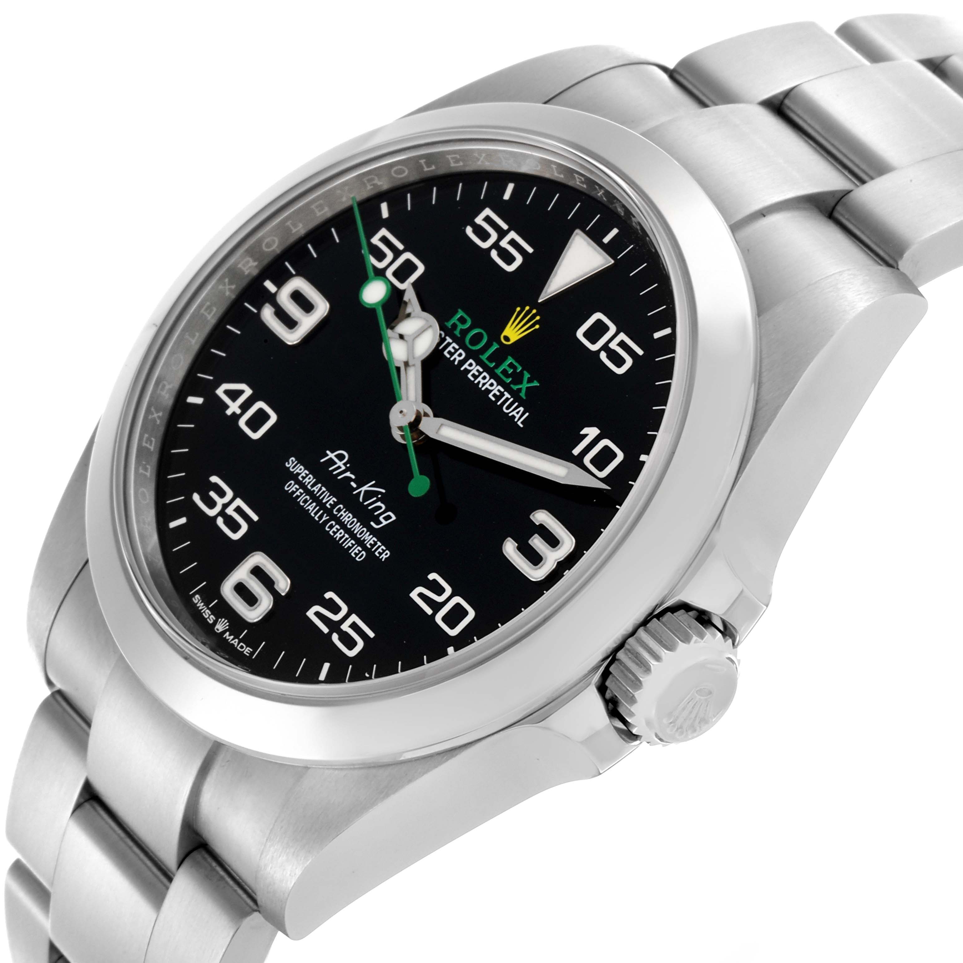 The Rolex Air-King 126900 Men's Stainless Steel Black Dial 126900 Men's Stainless Steel Black Dial watch is shown from a side angle, highlighting its case, face, crown, and bracelet.