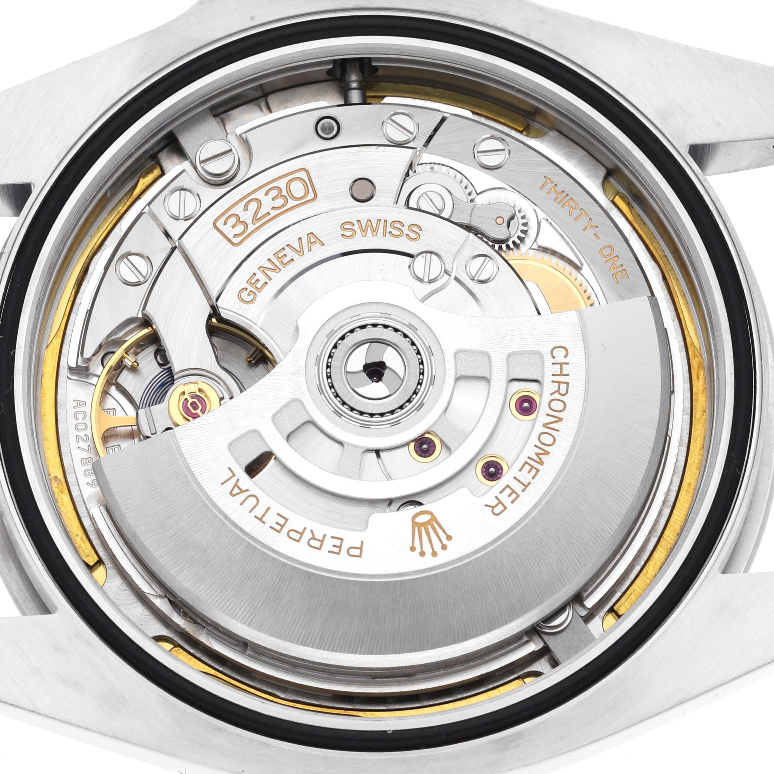 The image shows the Rolex Air-King 126900 Men's Stainless Steel Black Dial 126900 Men's Stainless Steel Black Dial movement from a top-down angle, highlighting the oscillating rotor and intricate mechanics.