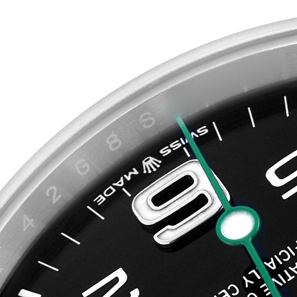 The image shows a close-up of the Rolex Air-King 126900 Men's Stainless Steel Black Dial 126900 Men's Stainless Steel Black Dial dial, focusing on the "9" marker and the "SWISS MADE" text at an oblique angle.