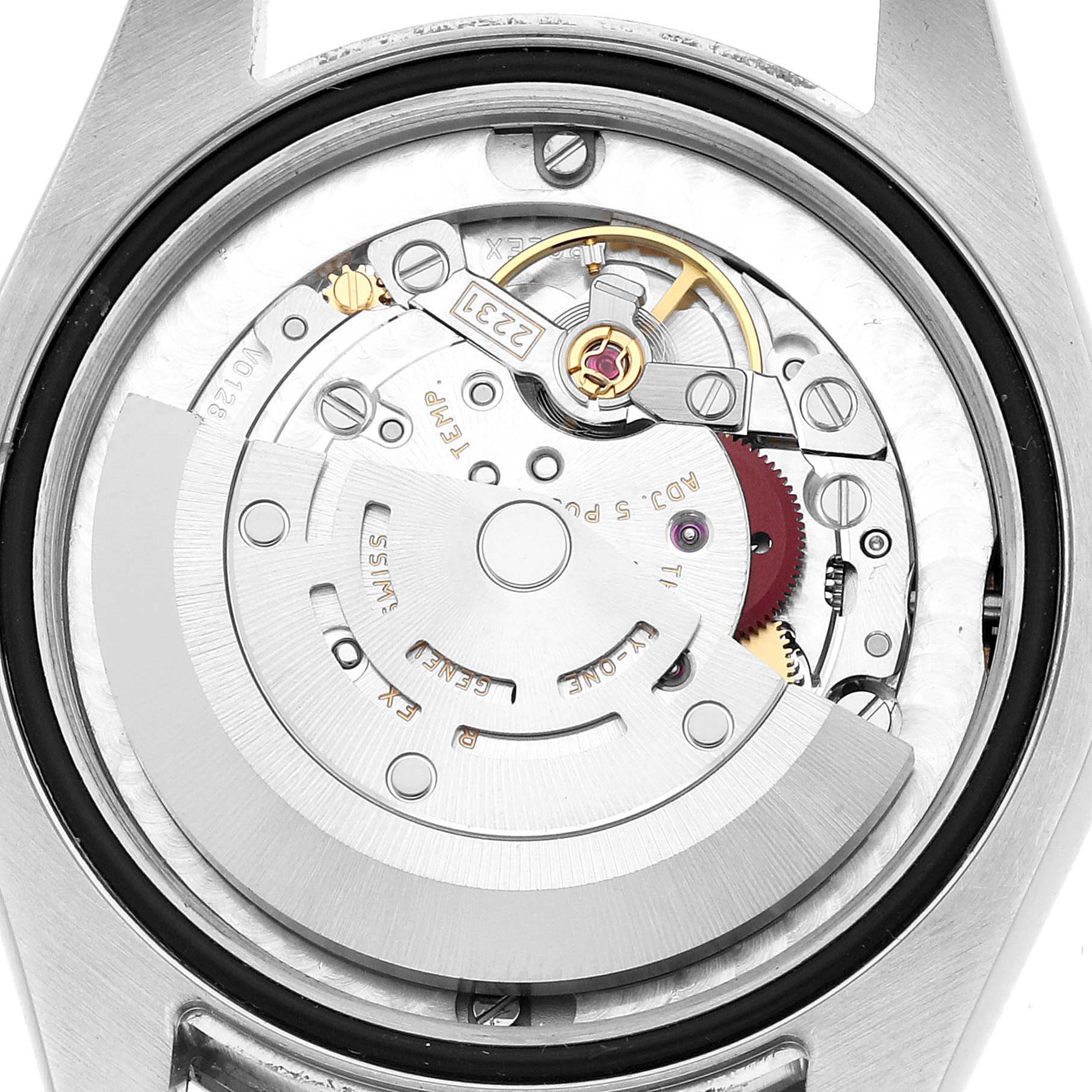 The image shows a top-down view of the movement inside a Rolex Mid-Size 177200 Women's Stainless Steel Black Dial watch, revealing gears and components.