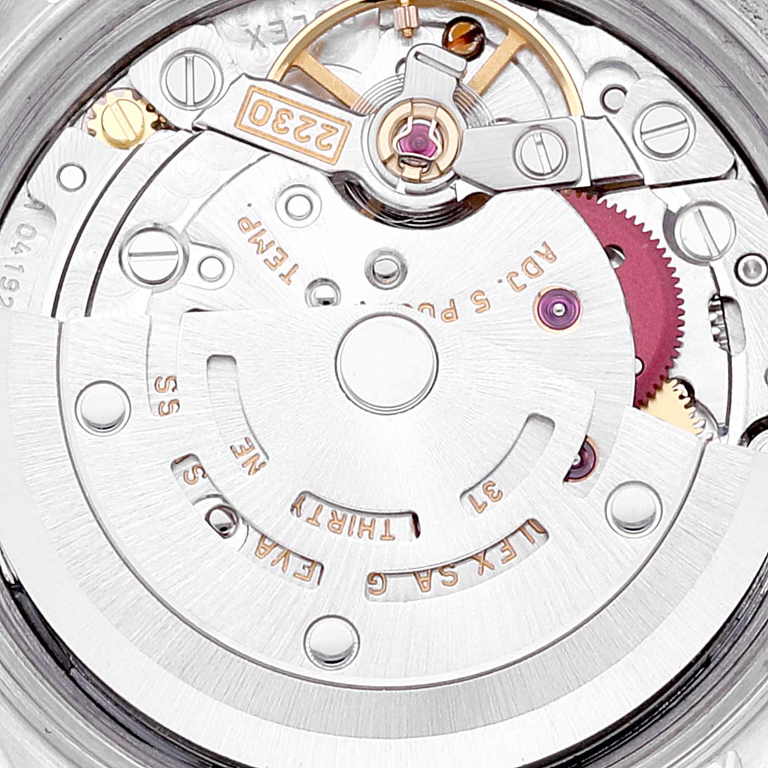 The image shows a close-up of the inner mechanical movement of a Rolex Oyster Perpetual 76030 Women
s Stainless Steel Blue Dial 76030 Women
s Stainless Steel Blue Dial watch.