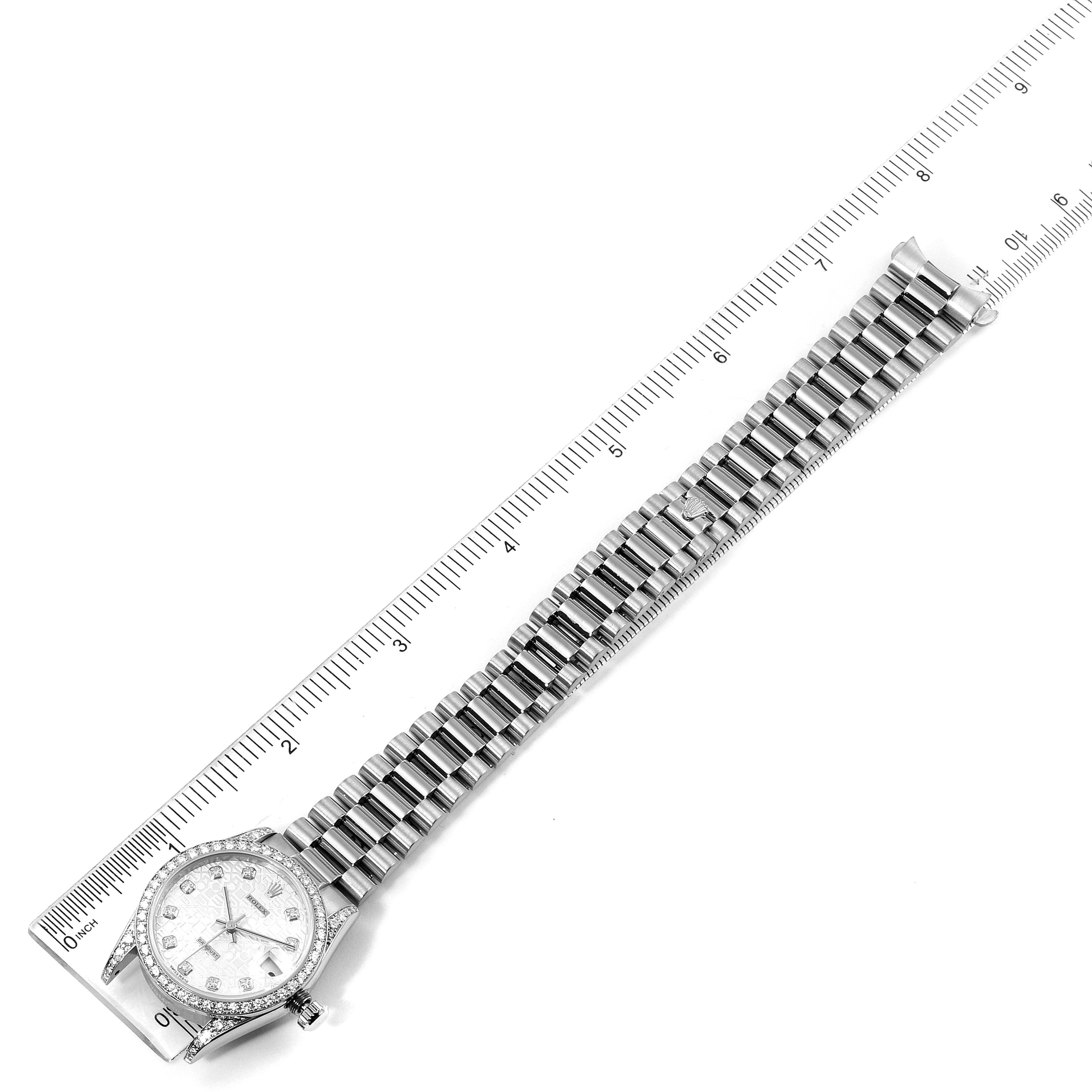 The image shows a top-down view of a Rolex President 68159 Women's White Gold Silver Dial 68159 Women's White Gold Silver Dial model watch, including its face and full bracelet beside a ruler.