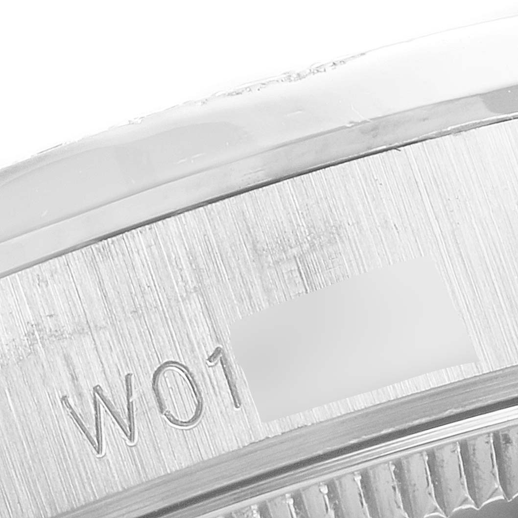 This image shows a close-up of the serial number engraving on the bezel of the Rolex President 68159 Women's White Gold Silver Dial 68159 Women's White Gold Silver Dial model watch.