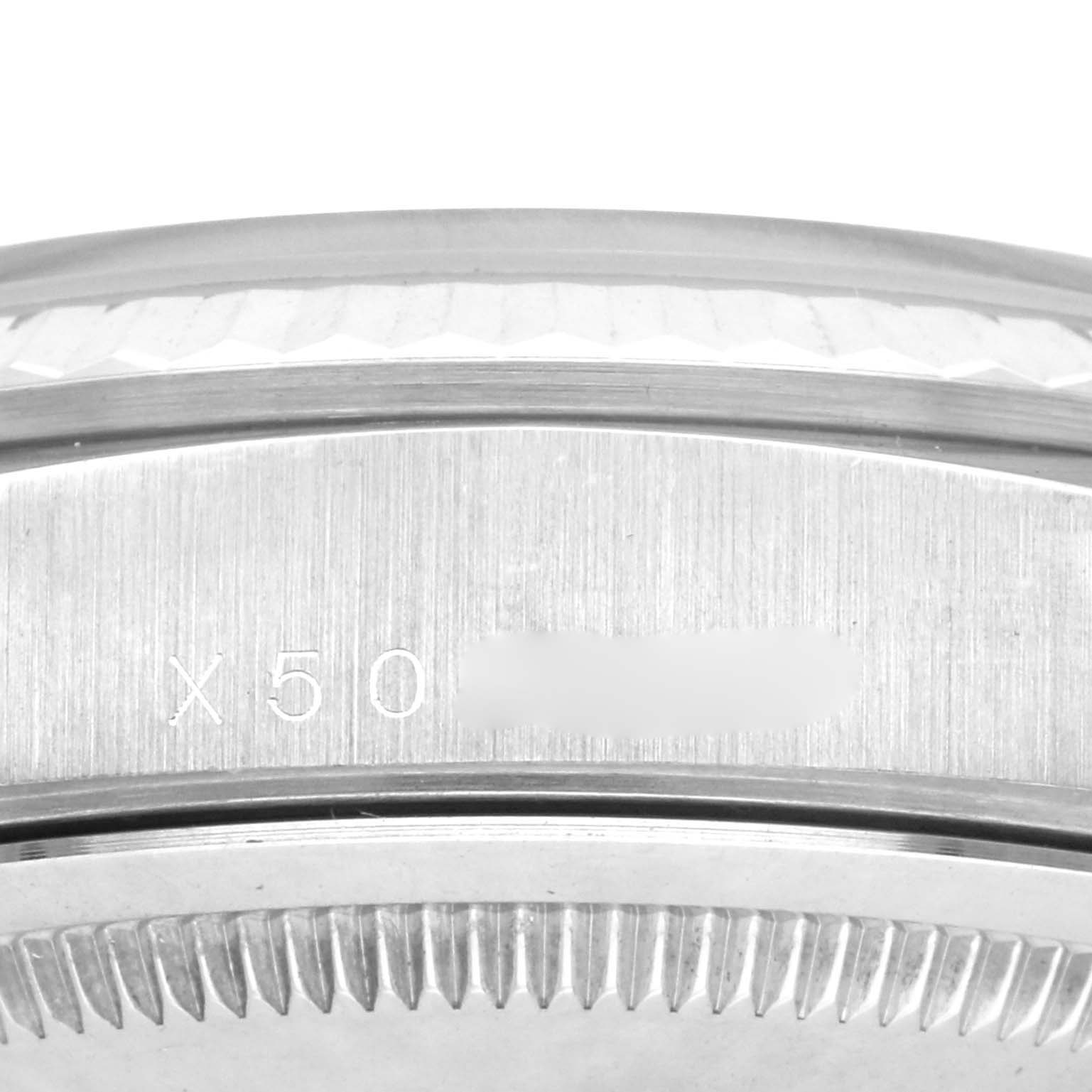 The image shows a close-up of the side of a Rolex President 18239A Men's White Gold Black Dial 18239A Men's White Gold Black Dial model watch, highlighting the edge and serial engraving.