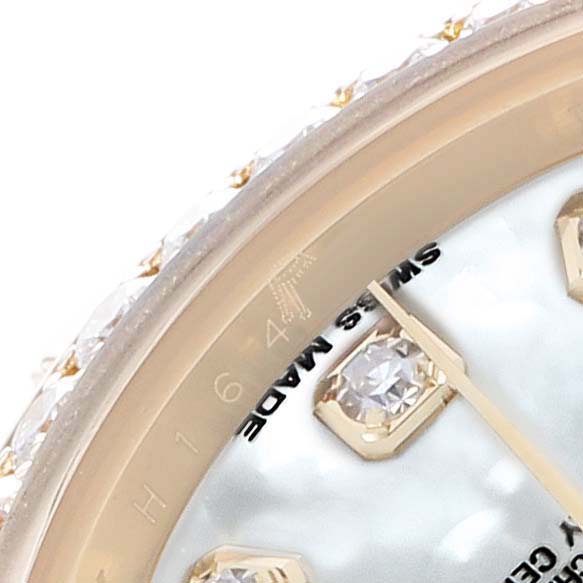 The image shows a close-up of the dial's edge and diamond markers on the Rolex President 179138 Women's Yellow Gold Mother of Pearl Dial watch.