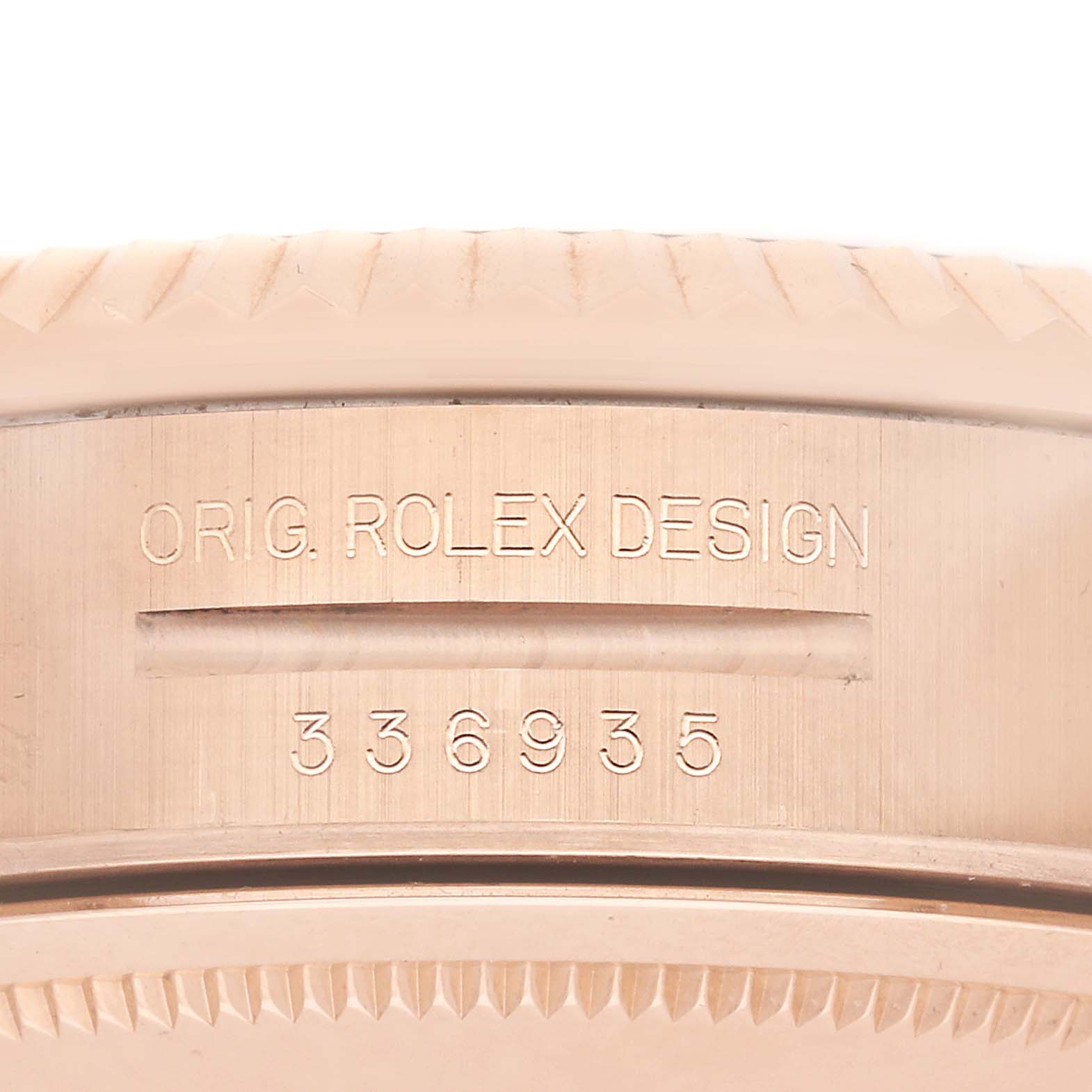 The image shows the side of a Rolex Sky-Dweller 336935 Men's Rose Gold Blue Dial, focusing on the case edge with "ORIG. ROLEX DESIGN" and a serial number engraved.