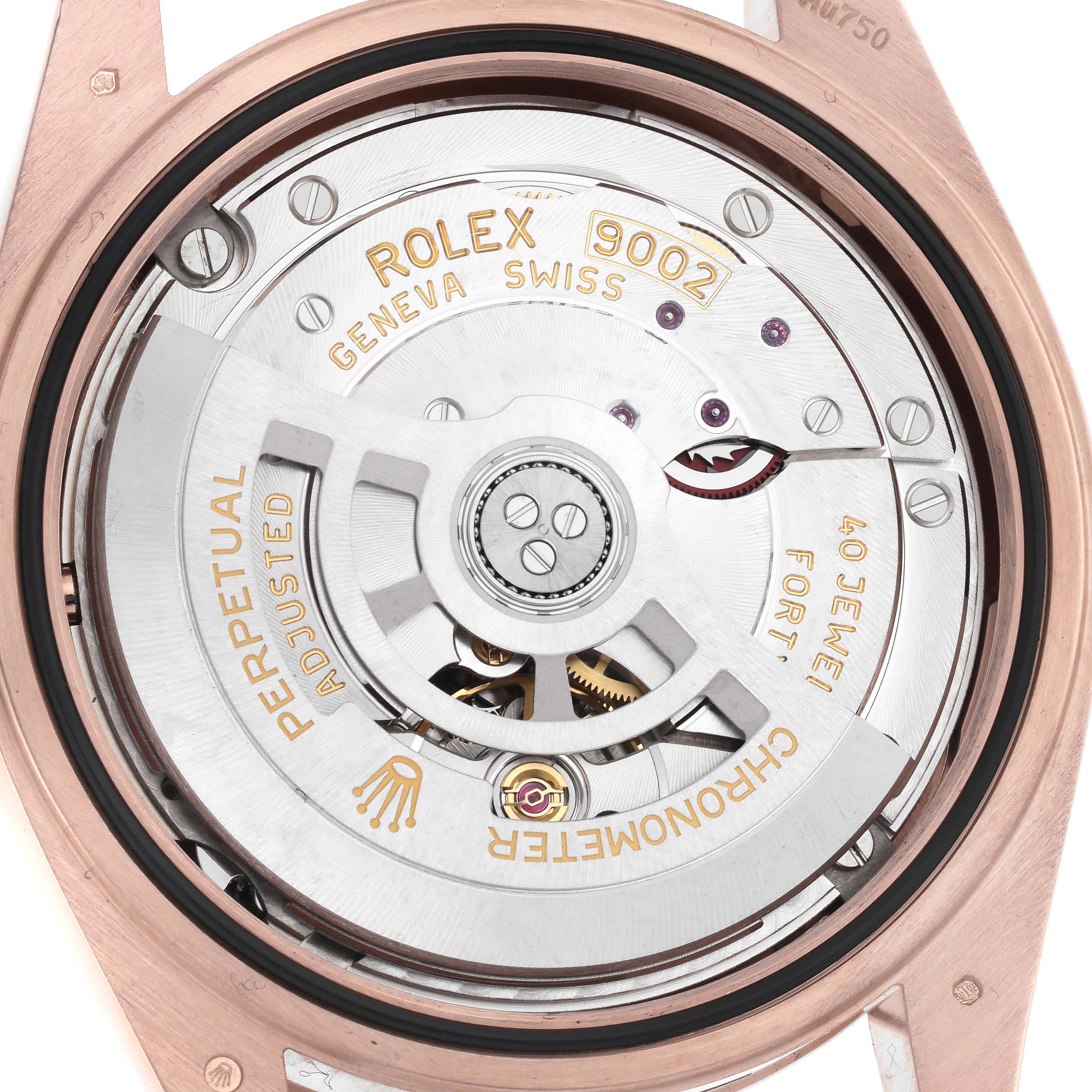 The image shows the movement of a Rolex Sky-Dweller 336935 Men's Rose Gold Blue Dial, focusing on the rotor and intricate internal components.