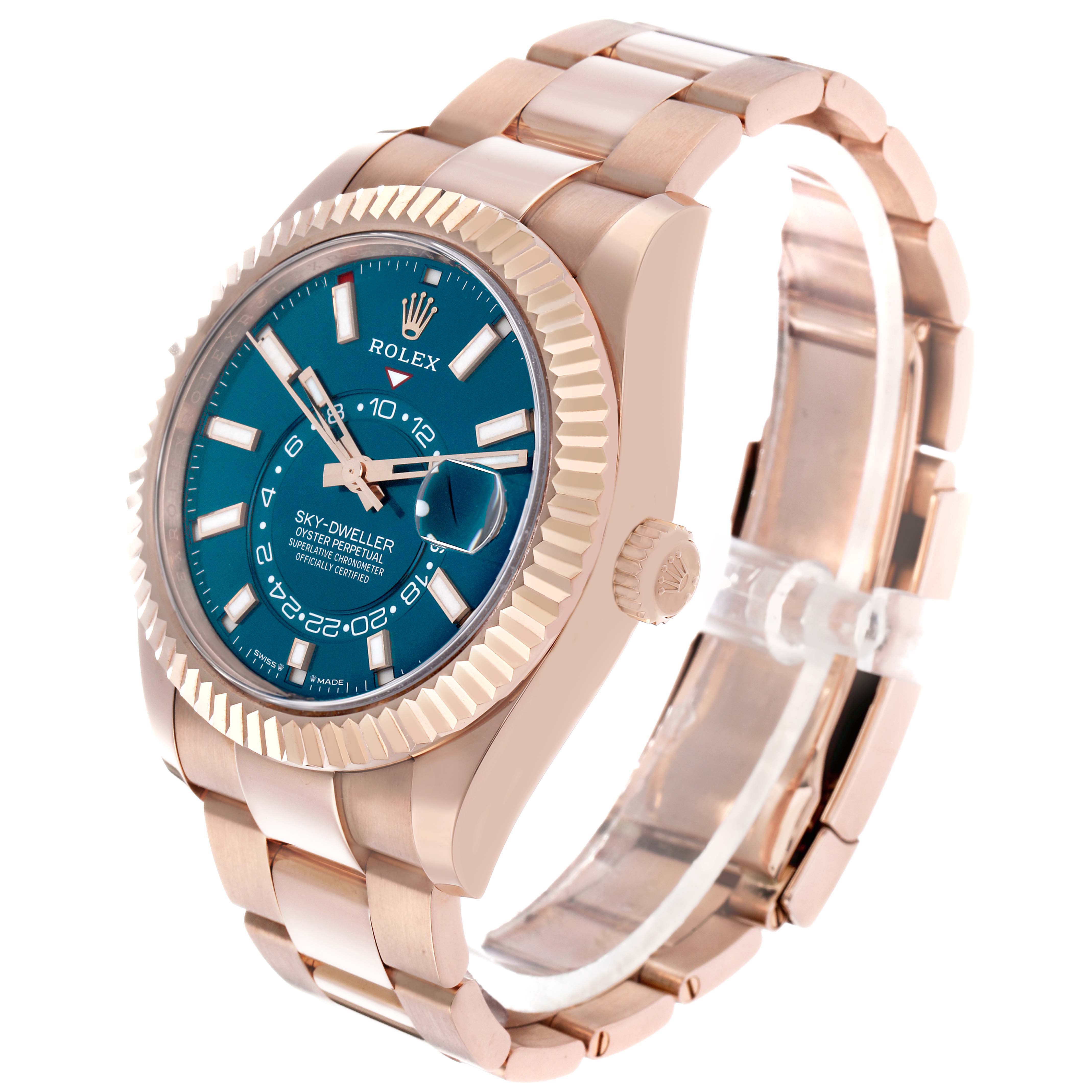 The Rolex Sky-Dweller 336935 Men's Rose Gold Blue Dial watch is shown at a three-quarter angle, highlighting the face, bezel, crown, and bracelet.