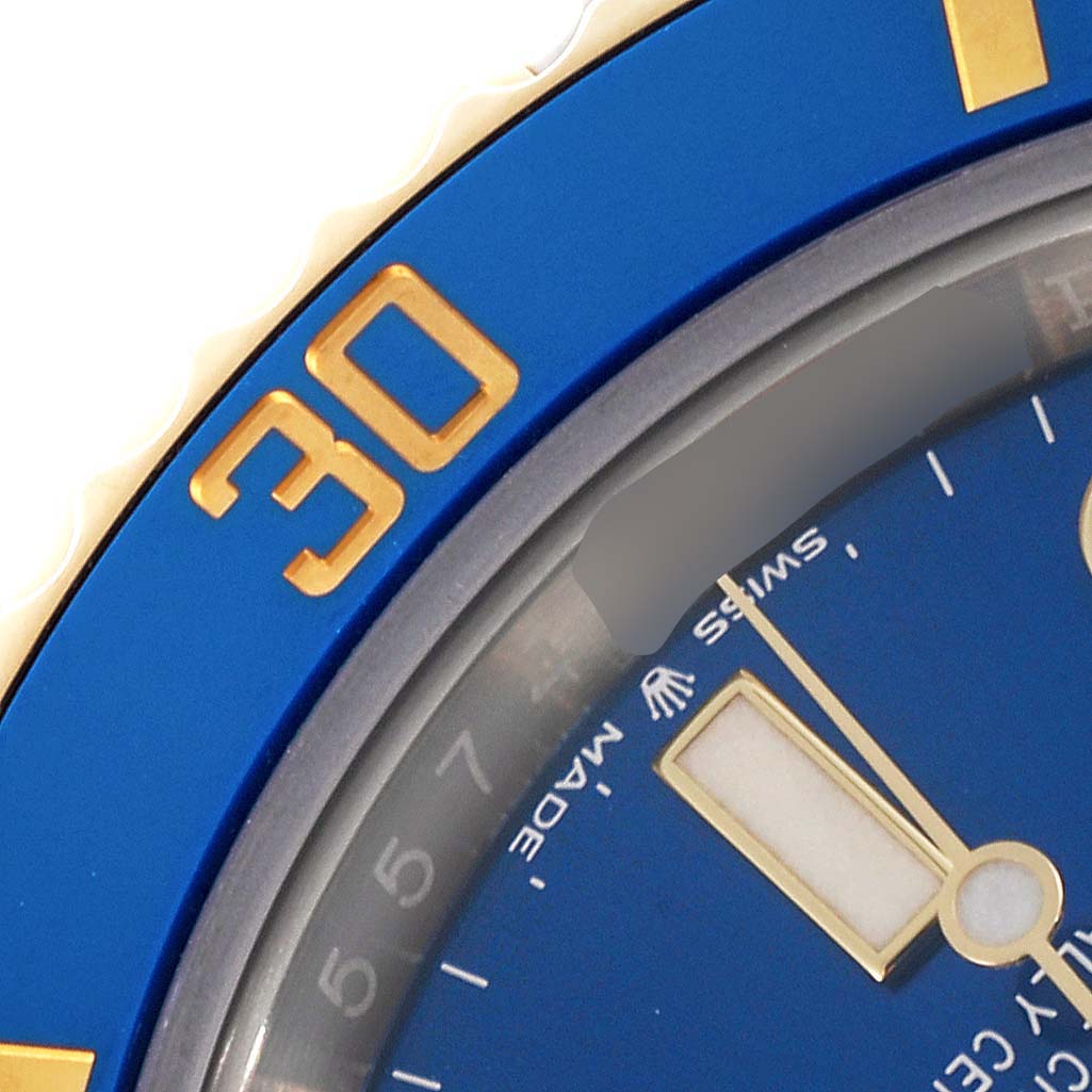 The image shows a close-up of the Rolex Submariner 126613LB Men's Steel and Gold (two tone) Blue Dial 126613LB Men's Steel and Gold (two tone) Blue Dial's blue bezel and part of the dial, focusing on the "30" marker.