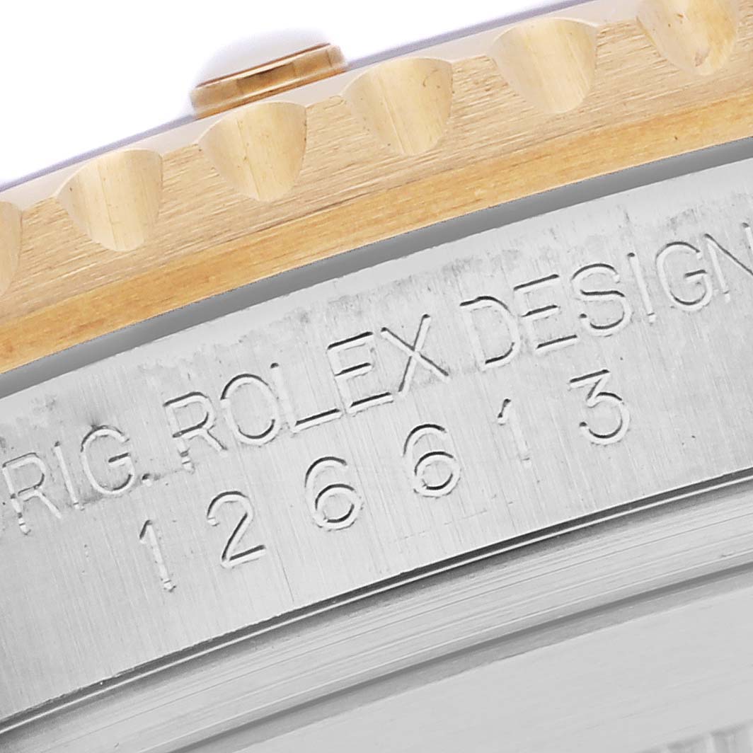The image shows a close-up of the bezel and case engraving on a Rolex Submariner 126613LB Men's Steel and Gold (two tone) Blue Dial 126613LB Men's Steel and Gold (two tone) Blue Dial.