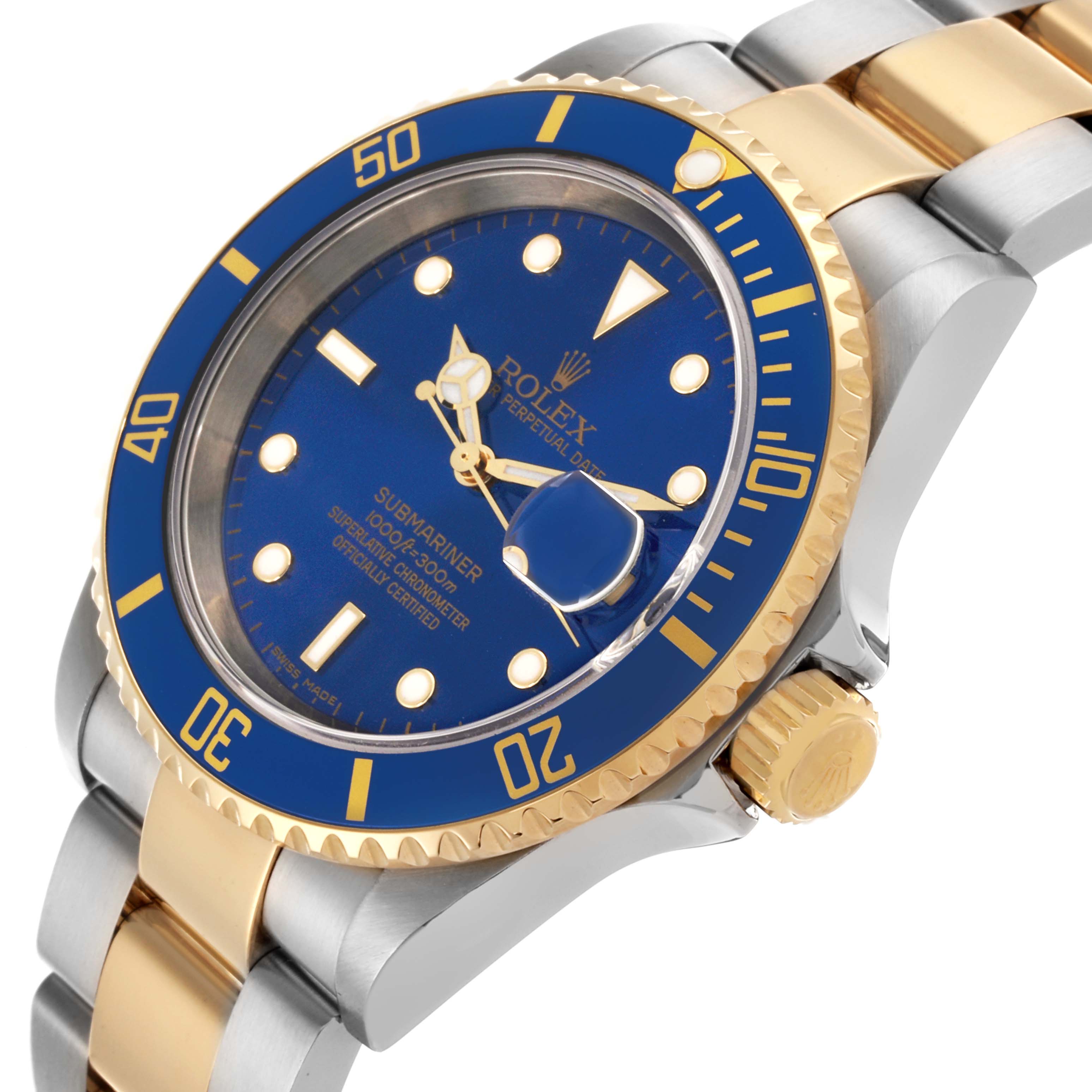The image shows a Rolex Submariner 16613 Men's Steel and Gold (two tone) Blue Dial 16613 Men's Steel and Gold (two tone) Blue Dial watch angled to display the blue dial, gold bezel, case, and part of the bracelet.