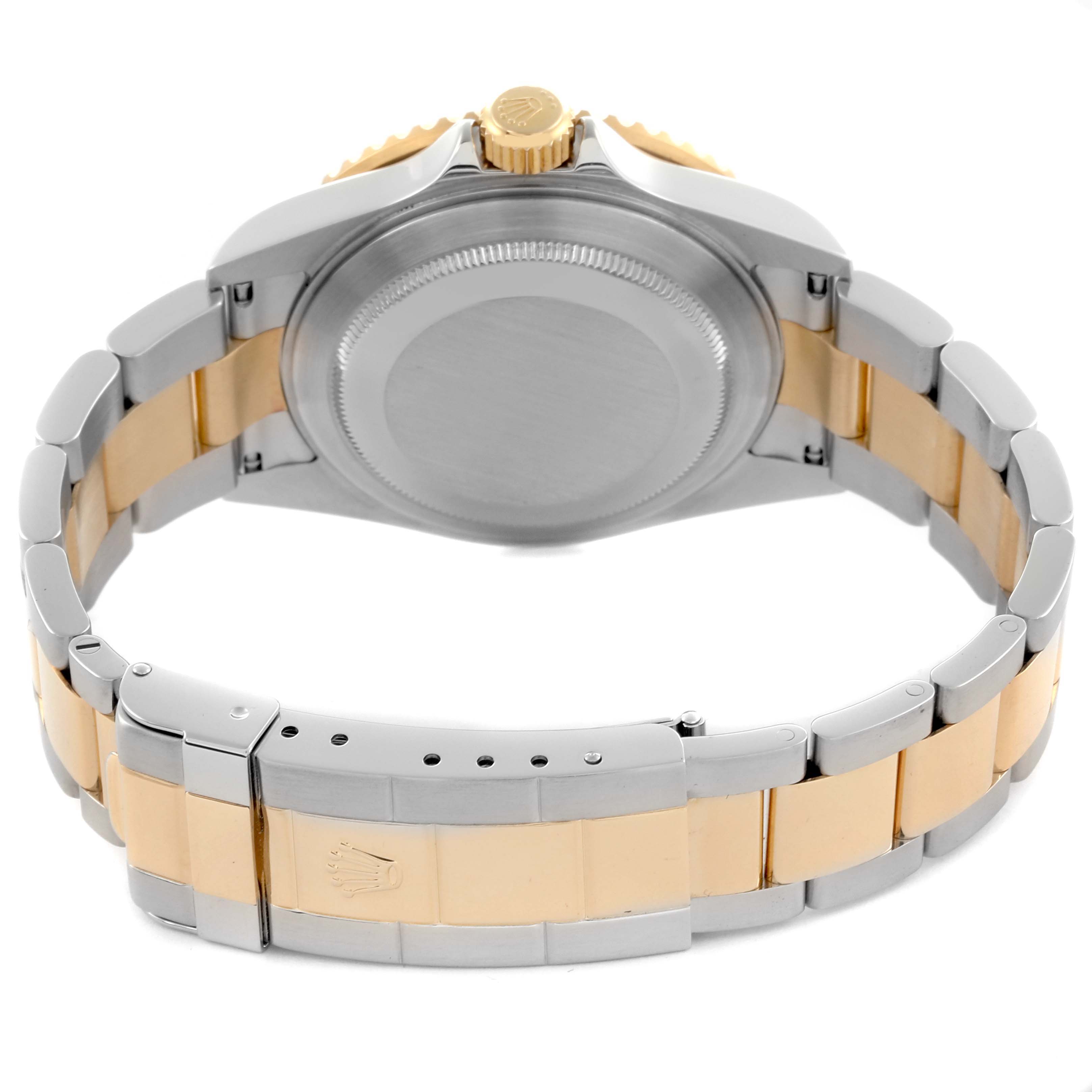 The image shows the back view of a Rolex Submariner 16613 Men's Steel and Gold (two tone) Blue Dial 16613 Men's Steel and Gold (two tone) Blue Dial, highlighting the case back and bracelet.