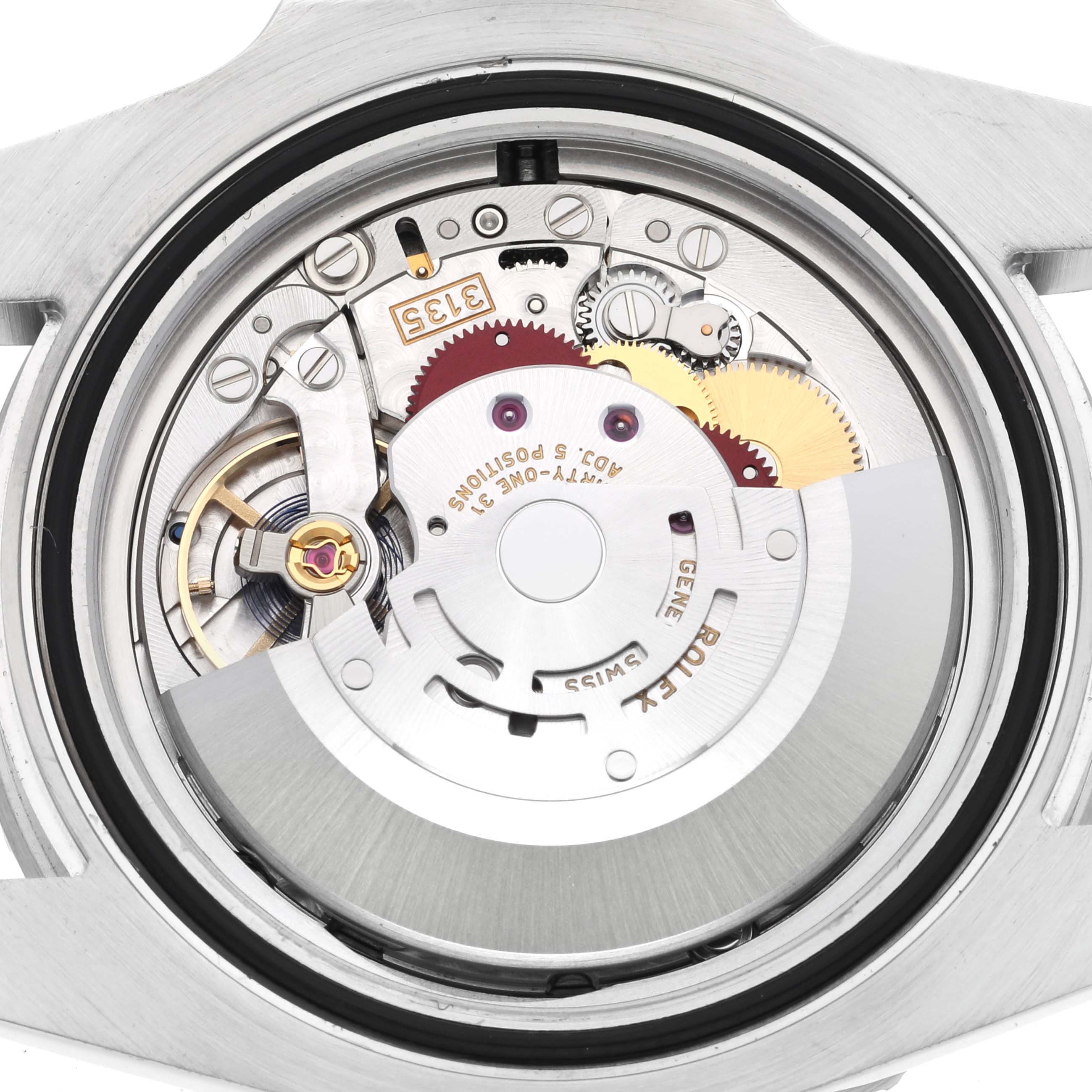 The image shows the movement of a Rolex Submariner 116610LV Men
s Stainless Steel Green Dial 116610LV Men
s Stainless Steel Green Dial watch, viewed from the back, highlighting its intricate components.