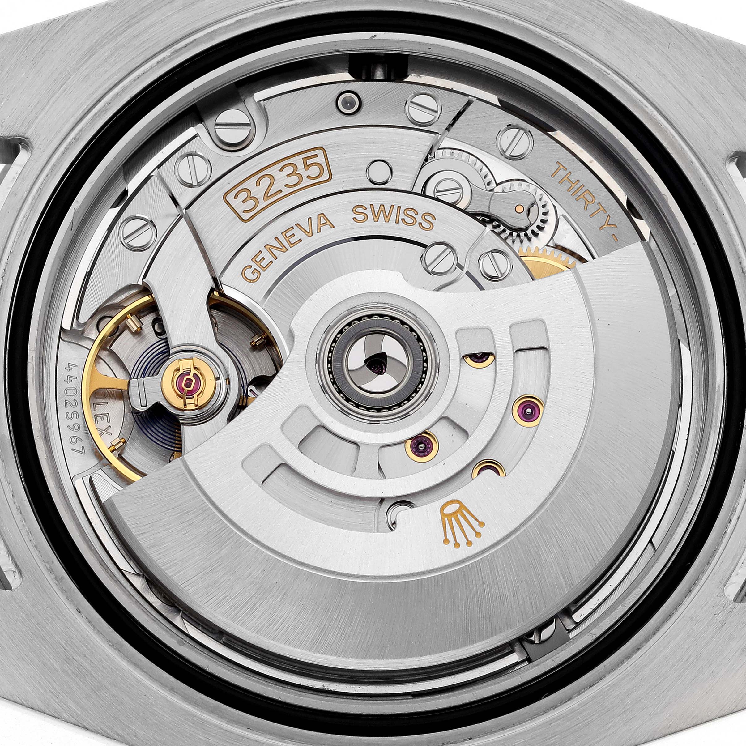 The image shows the movement of a Rolex Submariner 126610LV Men's Stainless Steel Black Dial 126610LV Men's Stainless Steel Black Dial, with internal components and engravings visible.