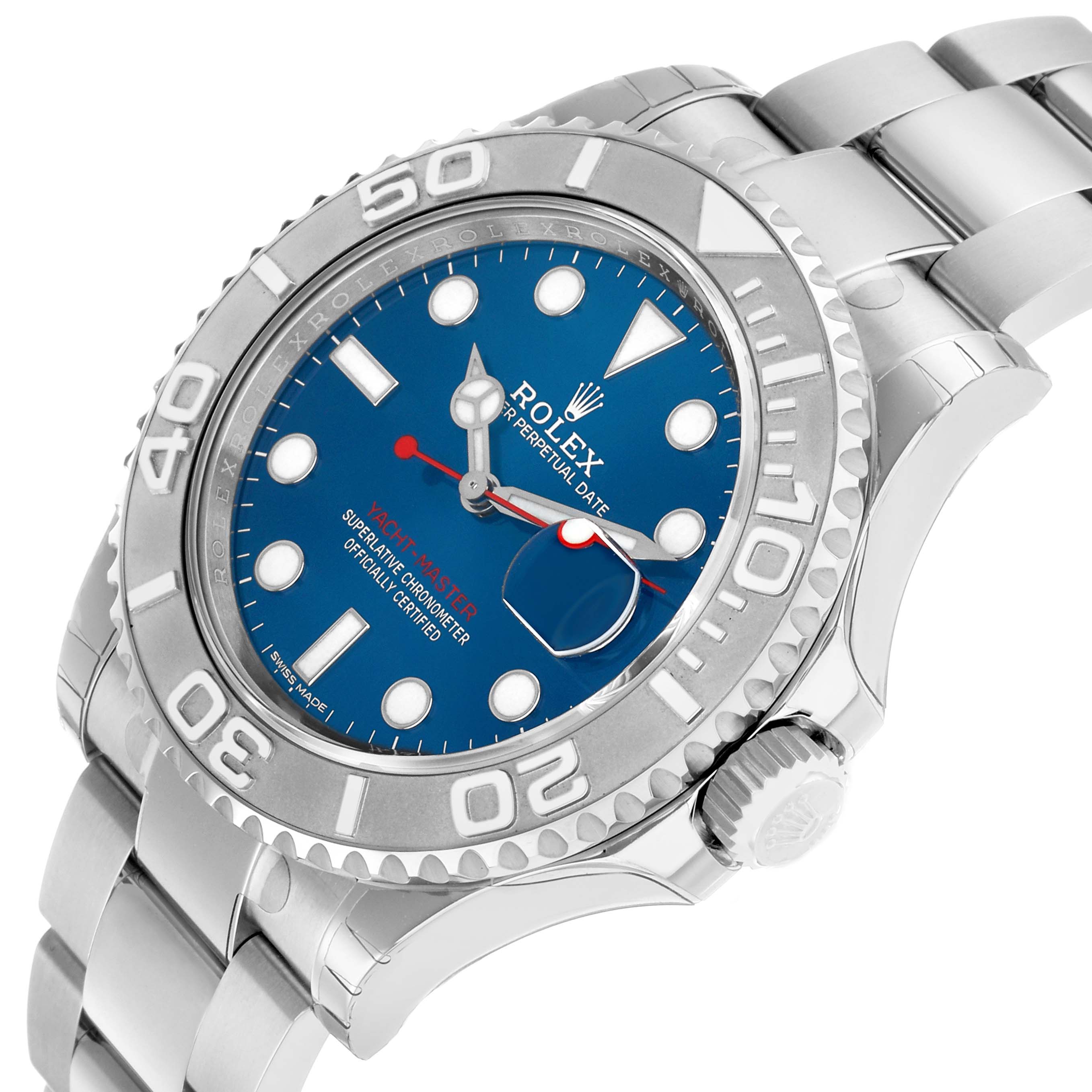 The Rolex Yacht-Master 116622 Men's Stainless Steel Blue Dial watch is shown at a tilted angle, featuring the dial, bezel, crown, and part of the bracelet.