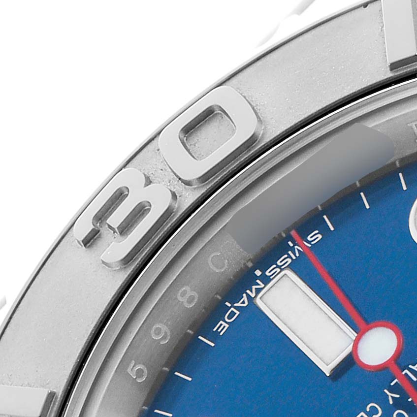 The image shows a close-up of the Rolex Yacht-Master 116622 Men's Stainless Steel Blue Dial watch, focusing on the bezel, part of the blue dial, and the minute hand.