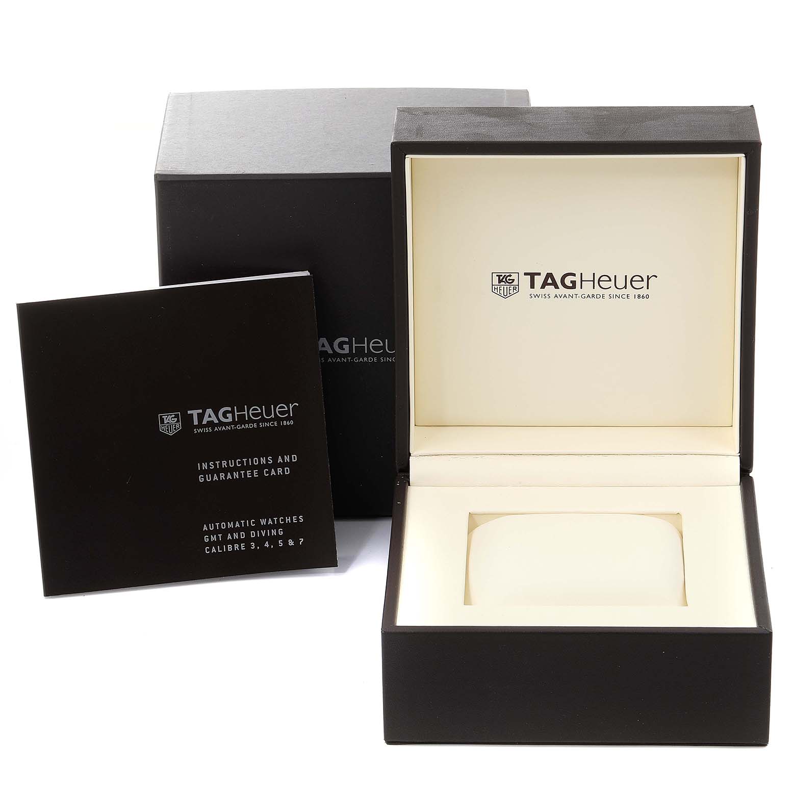 The image shows the packaging and user manual for a Tag Heuer Aquaracer WAK2180.FT6027 Men's Titanium Black Dial WAK2180.FT6027 Men's Titanium Black Dial watch, including the outer box, inner box, and instruction booklet.