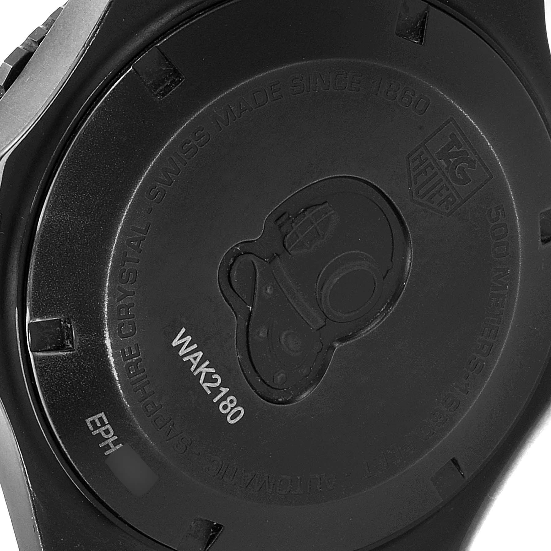 The image shows the back view of the Tag Heuer Aquaracer WAK2180.FT6027 Men's Titanium Black Dial WAK2180.FT6027 Men's Titanium Black Dial watch, displaying its case back and engravings.