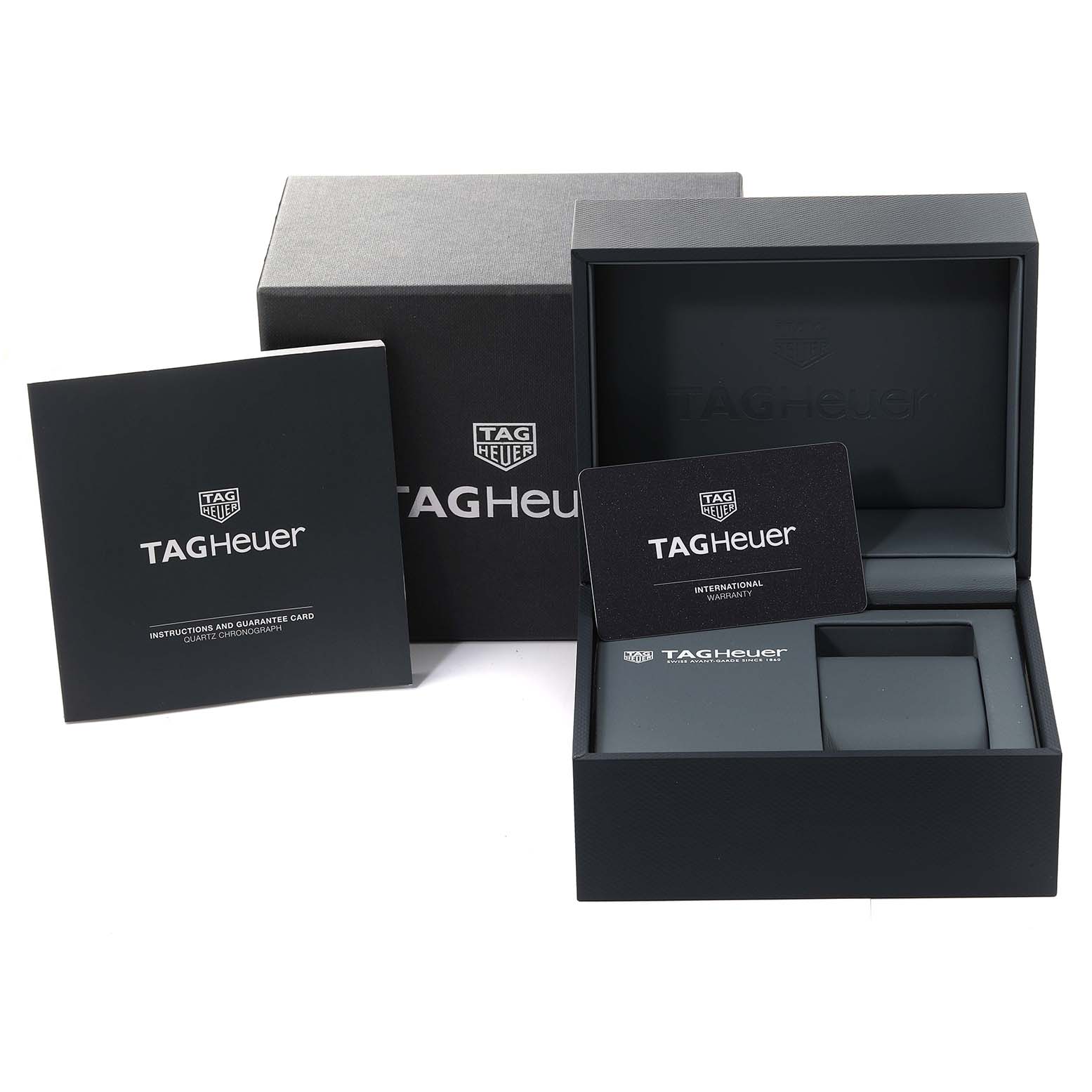 The image shows the packaging, instruction booklet, and international warranty card for a Tag Heuer Aquaracer CAY111B.BA0927 Men's Stainless Steel Blue Dial CAY111B.BA0927 Men's Stainless Steel Blue Dial watch.