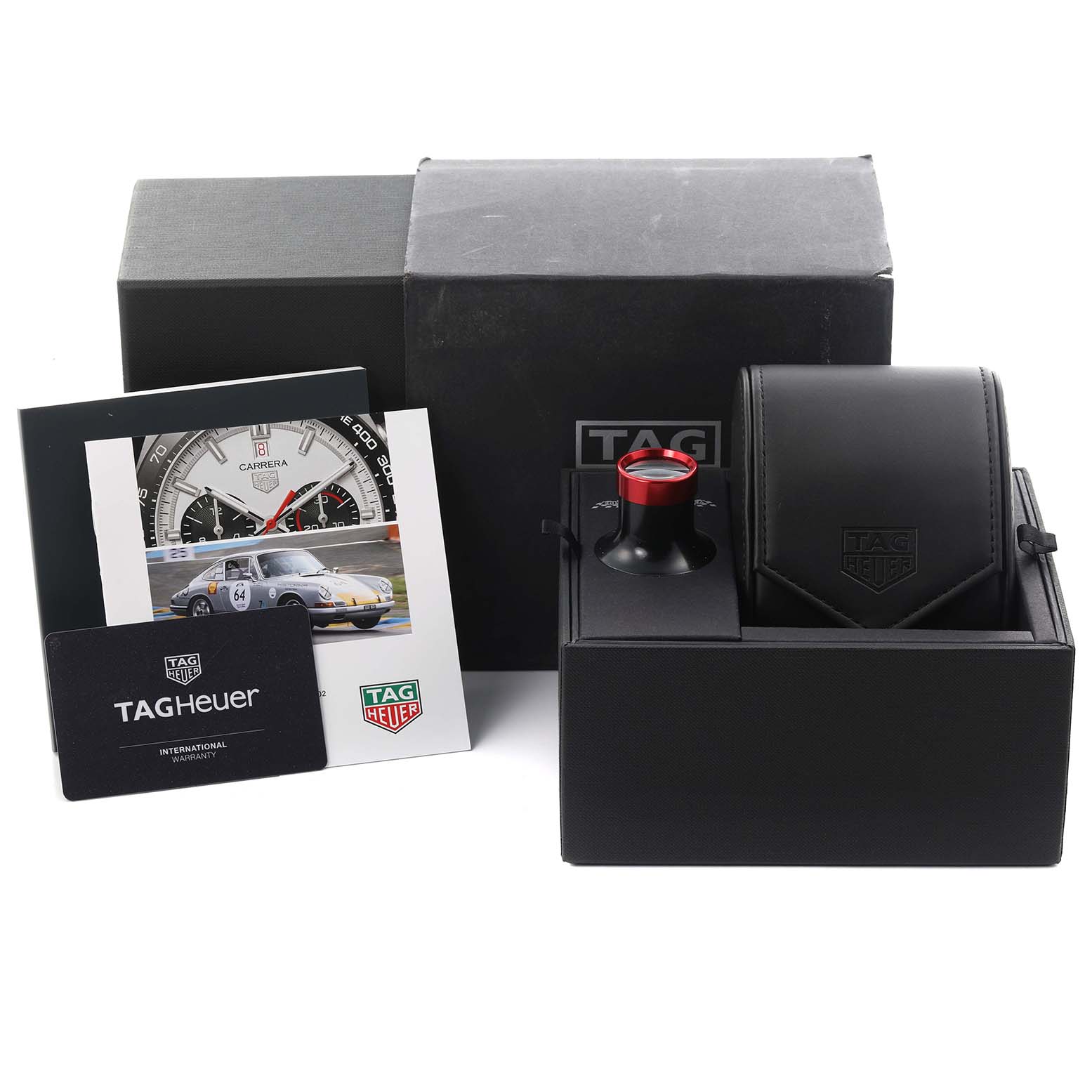 The image shows the Tag Heuer Carrera CBN2A1D.BA0643 Men's Stainless Steel Silver Dial CBN2A1D.BA0643 Men's Stainless Steel Silver Dial watch accessories, including a box, warranty card, booklet, and storage pouch.