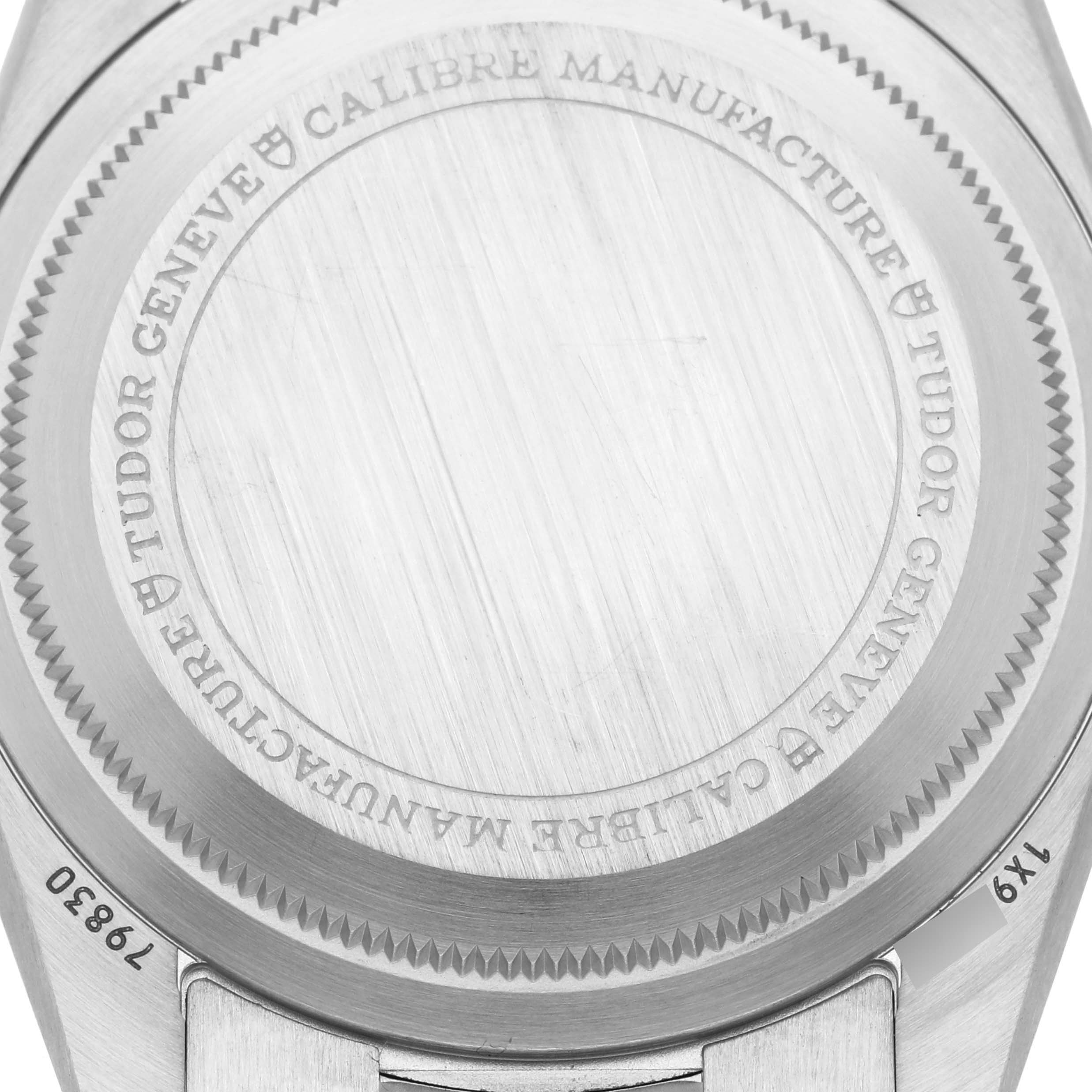 The image shows the engraved case back of a Tudor Heritage Black Bay 79830RB Men's Stainless Steel Black Dial 79830RB Men's Stainless Steel Black Dial watch from a close-up angle.