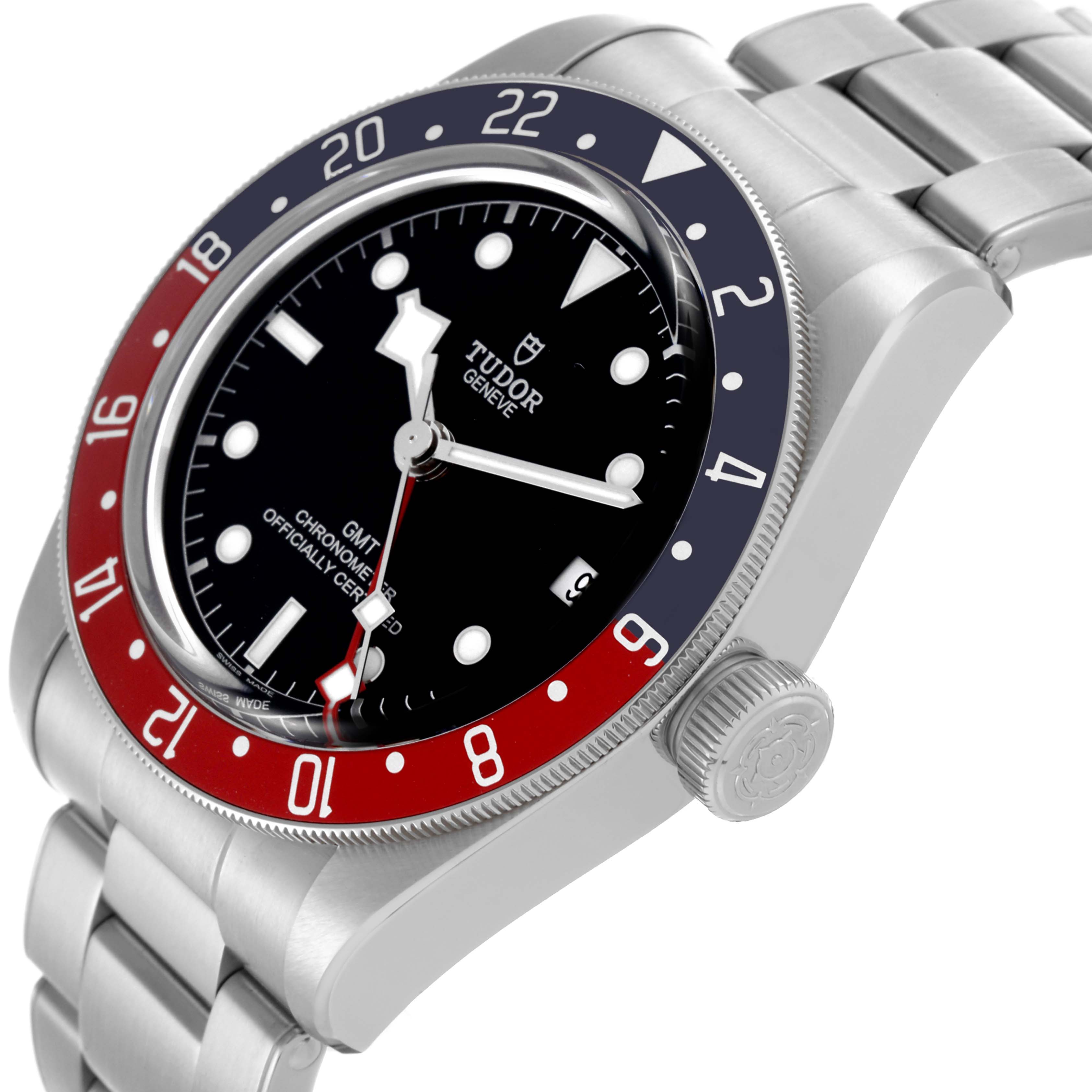 The Tudor Heritage Black Bay 79830RB Men's Stainless Steel Black Dial 79830RB Men's Stainless Steel Black Dial watch is shown at a tilted angle, highlighting the bezel, dial, bracelet, and crown.