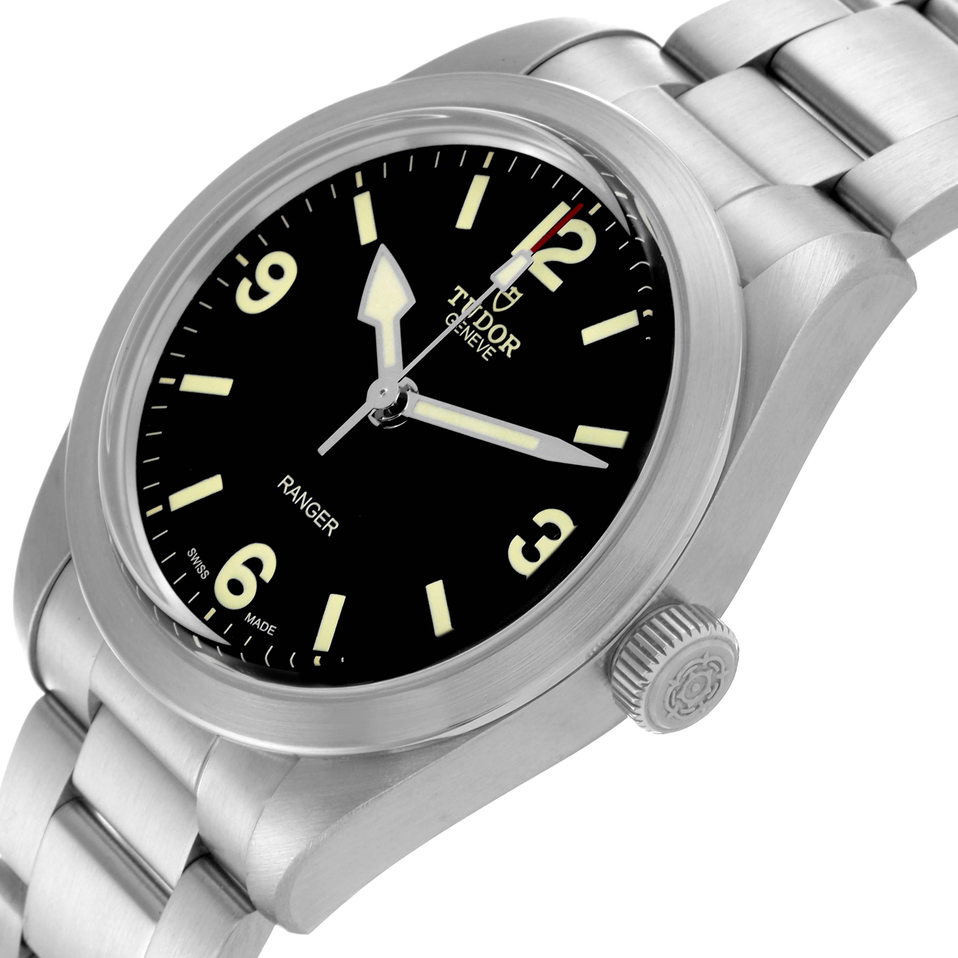 The Tudor Monarch 79950-0001 Men's Stainless Steel Black Dial 79950-0001 Men's Stainless Steel Black Dial watch is shown at an angled view, displaying the face, hands, crown, and a portion of the bracelet.