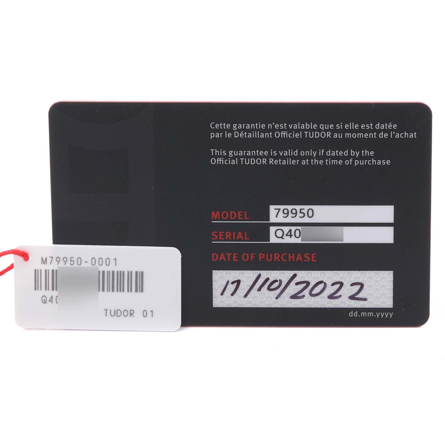 The image shows warranty cards and tags for the Tudor Monarch 79950-0001 Men's Stainless Steel Black Dial 79950-0001 Men's Stainless Steel Black Dial model watch.