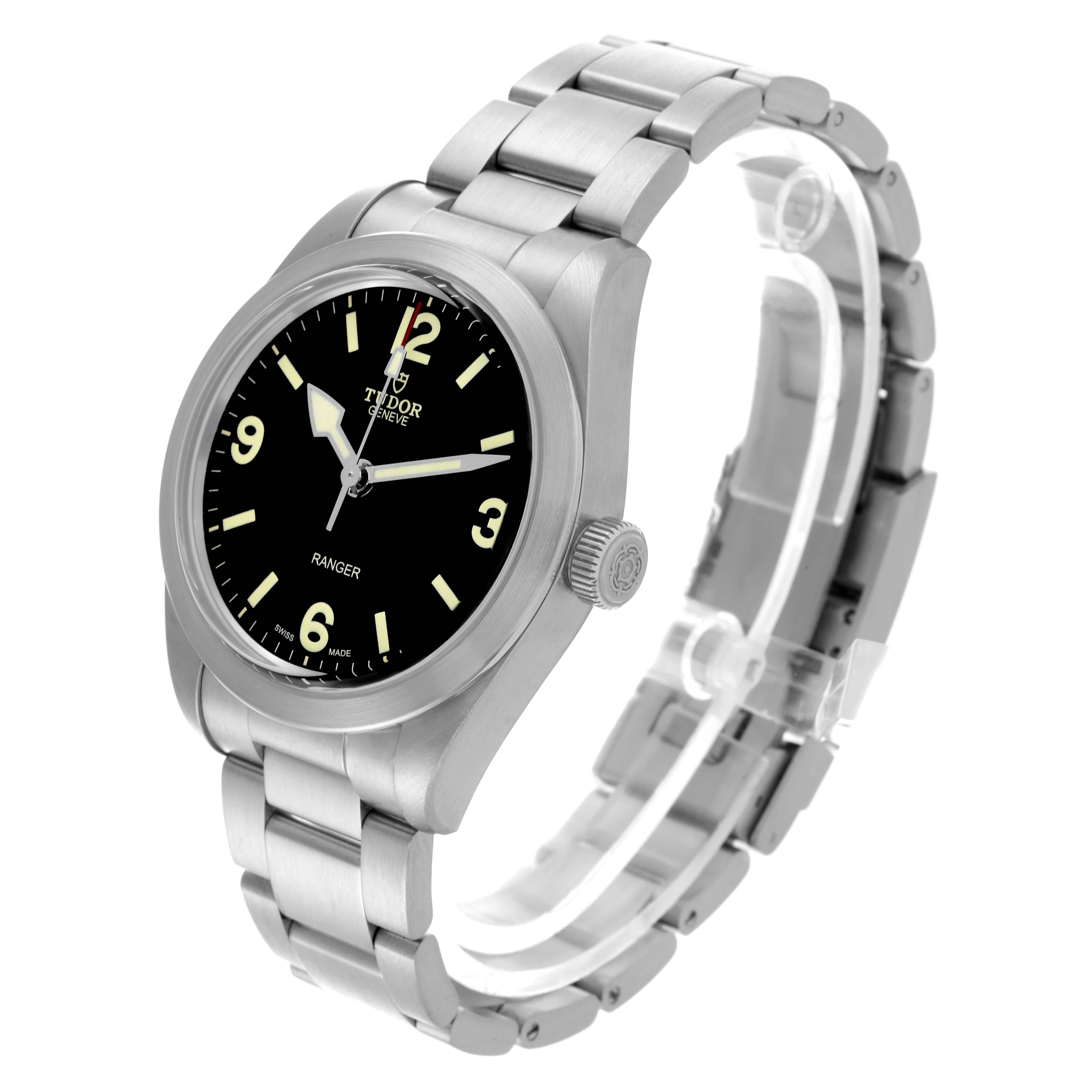 The Tudor Ranger watch is shown at a three-quarter angle, highlighting the face, crown, and bracelet.