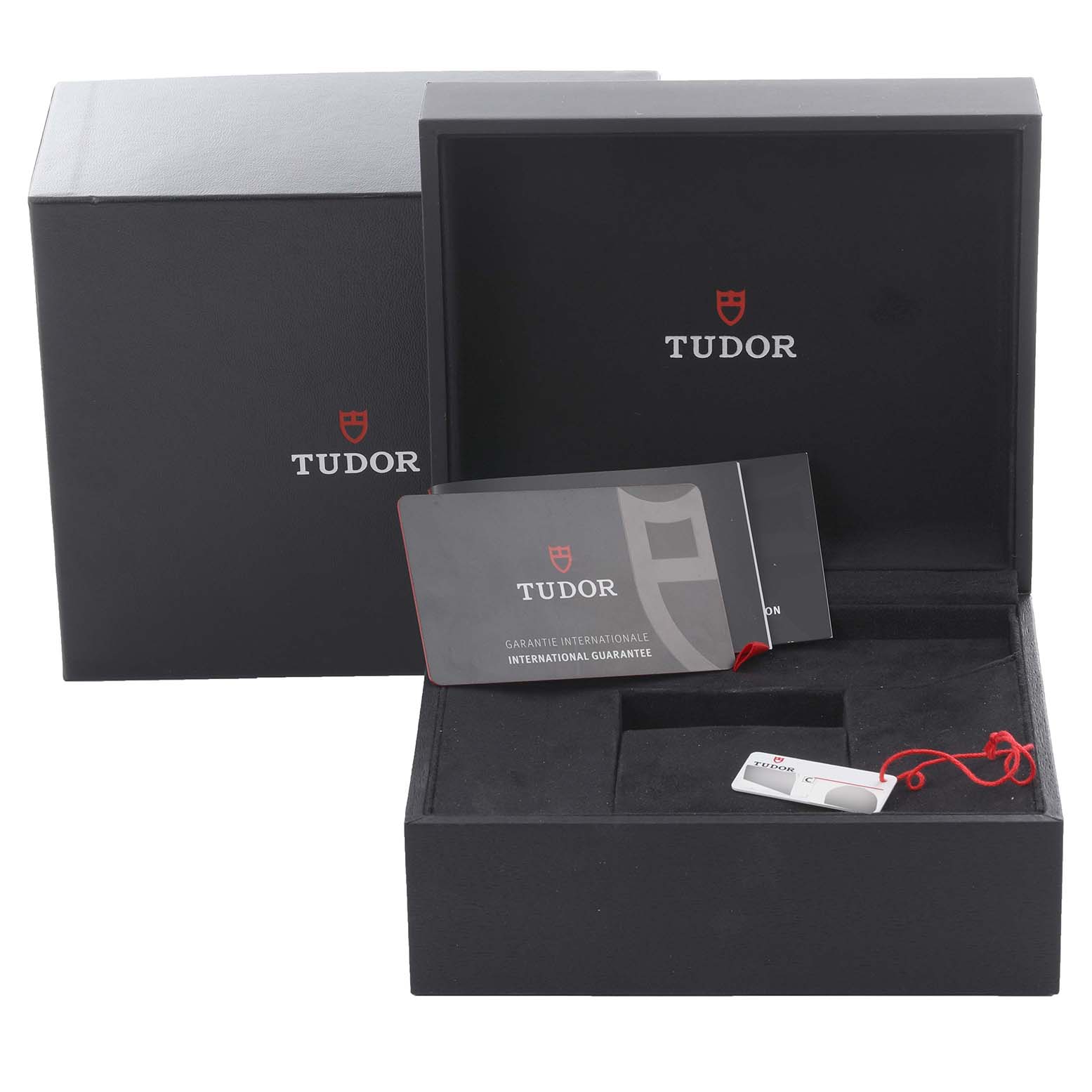 This image shows the packaging and warranty card for the Tudor Monarch 79950-0001 Men's Stainless Steel Black Dial 79950-0001 Men's Stainless Steel Black Dial model, viewed from the front.