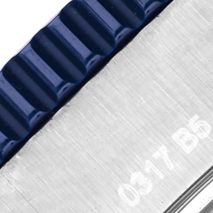 The image shows a close-up of the bezel and part of the casing of the Breitling Superocean Y17393 Men's Stainless Steel Blue Dial Y17393 Men's Stainless Steel Blue Dial watch.
