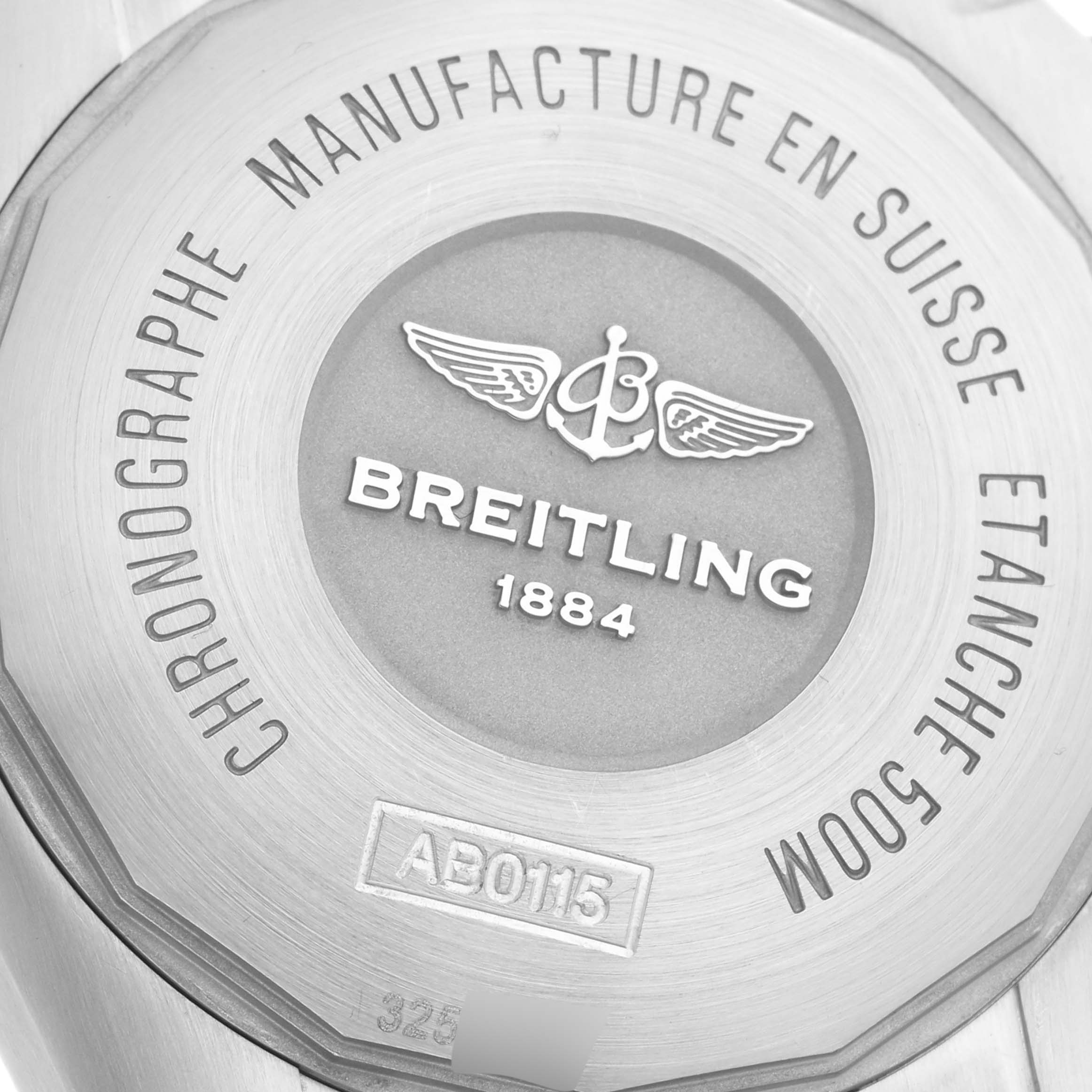 The image shows the engraved back case of a Breitling Chronomat AB0115 Men's Stainless Steel Blue Dial AB0115 Men's Stainless Steel Blue Dial watch with branding and model details.