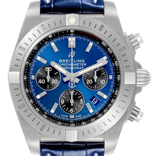 The Breitling Chronomat watch is shown from the front, highlighting the bezel, blue dial, sub-dials, and case.