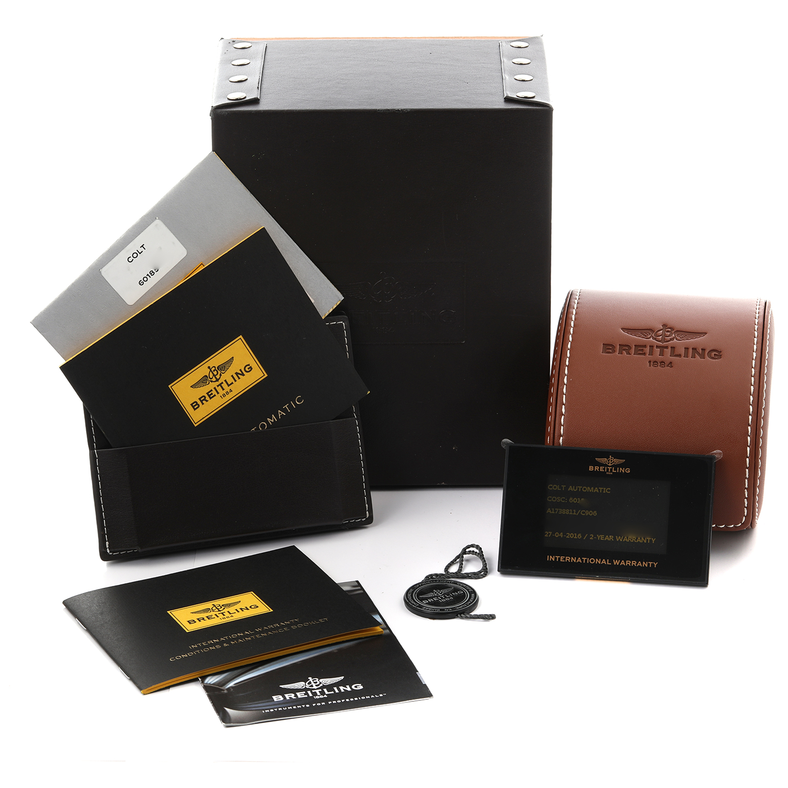 The image shows Breitling Colt A17388 Men's Stainless Steel Blue Dial A17388 Men's Stainless Steel Blue Dial watch accessories, including boxes, manuals, a warranty card, and a pouch, captured from the front.