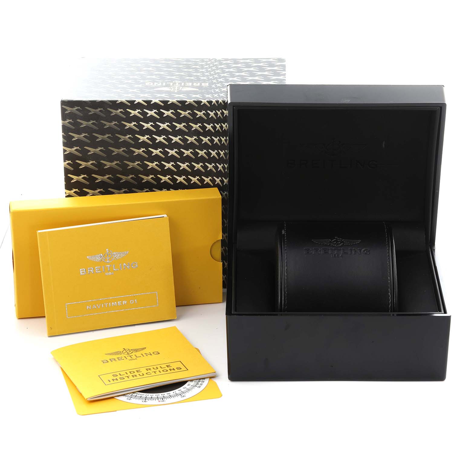 The image shows the packaging and manuals for a Breitling Navitimer AB0120 Men
s Stainless Steel Black Dial AB0120 Men
s Stainless Steel Black Dial, including a box and instruction booklets.