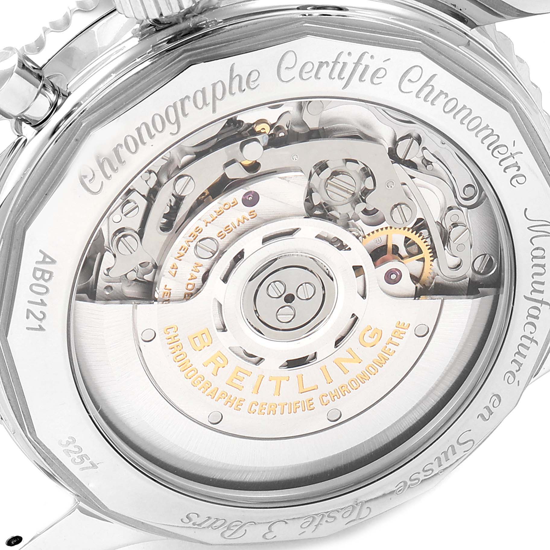 The image shows a close-up of the Breitling Navitimer AB0121 Men
s Stainless Steel Black Dial AB0121 Men
s Stainless Steel Black Dial watch’s case back, revealing its internal mechanical movement.